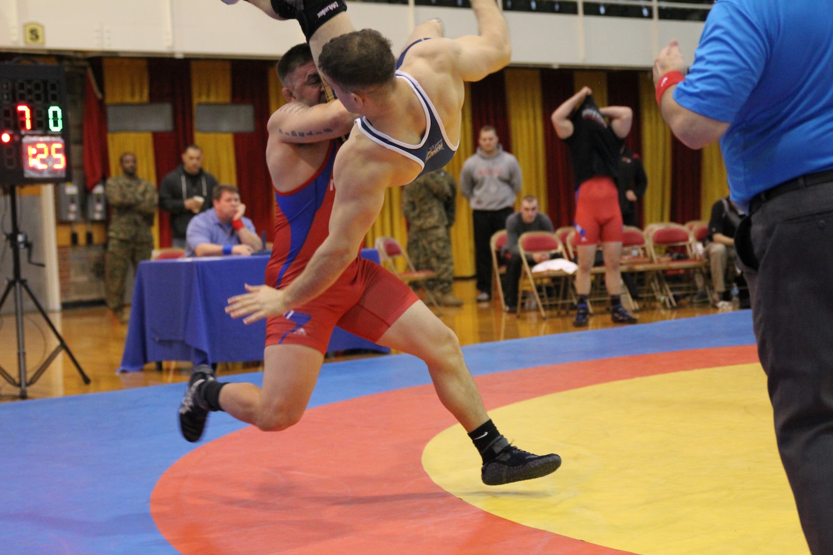 Marine Cpl Courtney Myers (Camp Lejeune, NC) slams Navy PO2 Gary DiMarzio (Kings Bay, GA) to the mat in a 12-0 win at the 2014 Armed Forces Wrestling Championship at MCB Camp Lejeune, NC 7-8 March.  