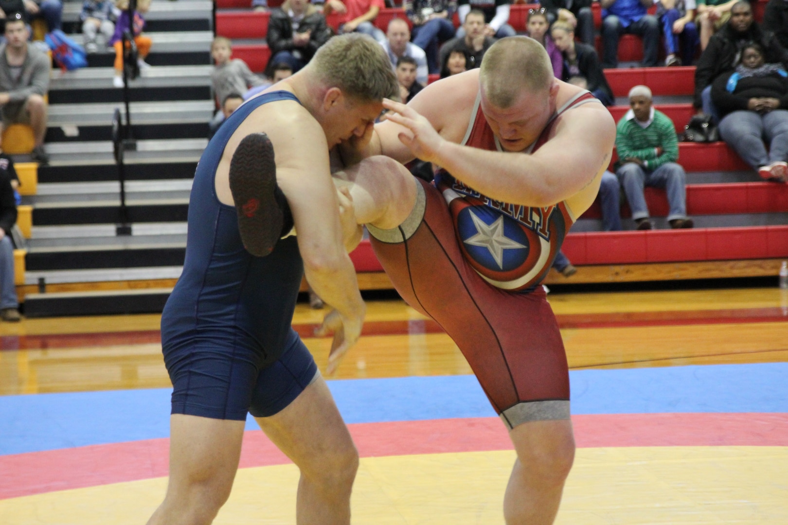 Army PFC Eric Nye battles Marine 1stLt Scott Steele in the Freestyle 125kg competition.  Steele led the match 4-0 early on, but Nye tied the score on one throw and turned the tide winning by pinfall with 16 seconds left in the match.  