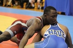Two-time Olympian Army SGT Spencer Mango wins his second 2014 Armed Forces Wrestling gold medal after winning both Greco-Roman and Freestyle events.  Here, Mango defeats silver medalist Navy PO3 Sheldon Wilder 15-5 in the second period during the 57kg Freestyle competition.  