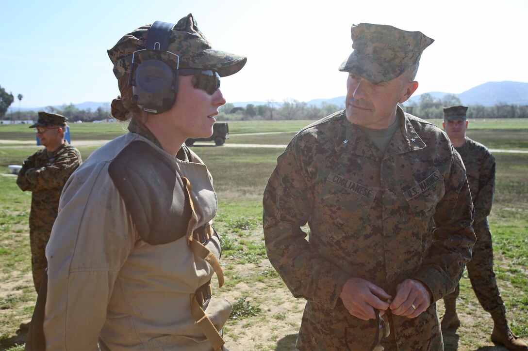 Brig. Gen. Vincent A. Coglianese, commanding general, 1st Marine Logistics Group, speaks to 2nd Lt. Emily A. Conard, platoon commander with General Support Motor Transport Company, Combat Logistics Regiment 1, 1st Marine Logistics Group, about her participation in the 2014 Western Division matches aboard Marine Corps Base Camp Pendleton, Calif., March 5, 2014. Marines from CLRs 17, 1, 15 and 7th Engineer Support Battalion, 1st MLG, competed against approximately 200 Marines from throughout the west coast to prove their marksmanship skills with the M16 service rifle, the M4 carbine and the M9 service pistol, Feb 24 – March 7, 2014. 
