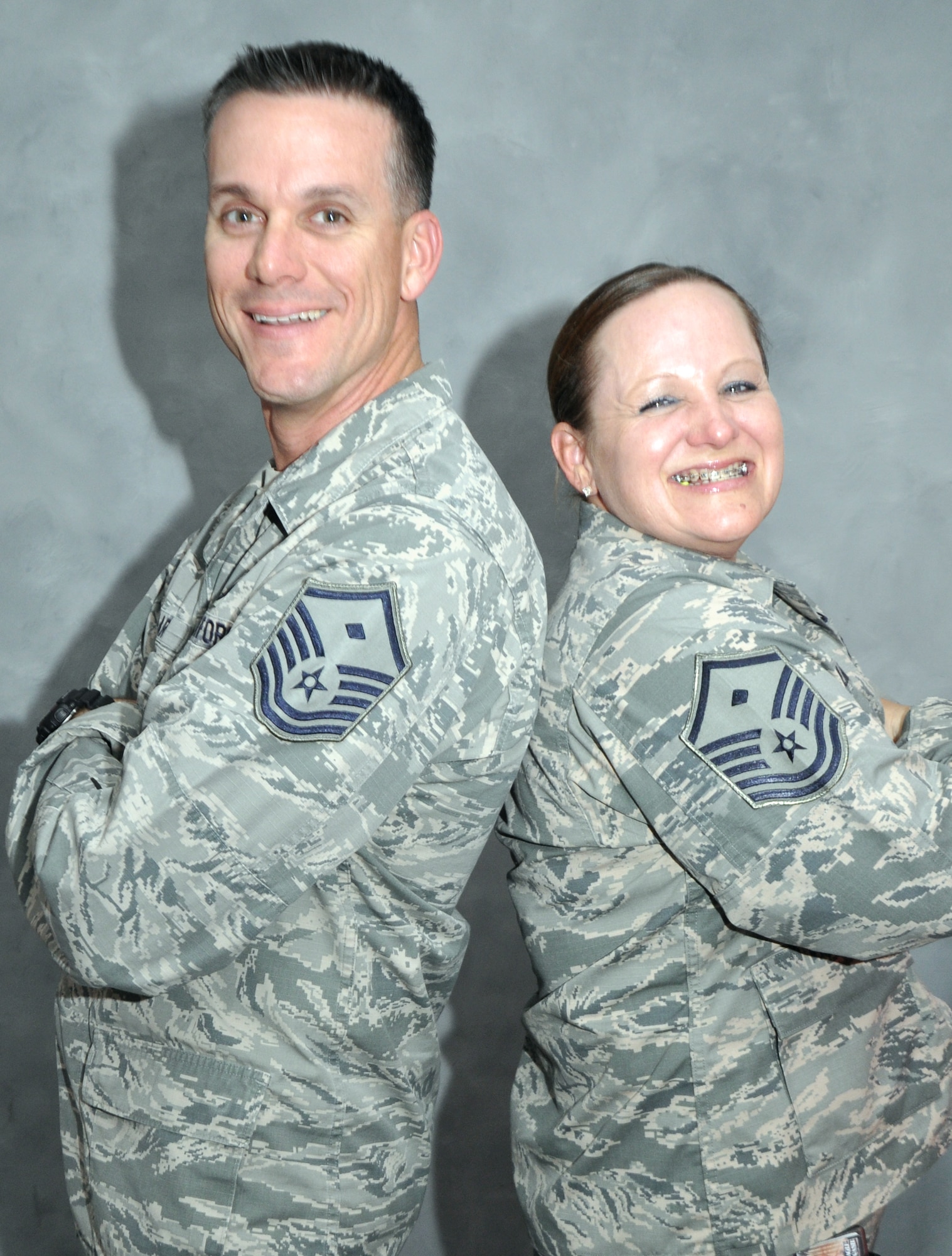 Air Force Master Sgts. Shawn and Lynnette Tolar, who serve as first sergeants for the 380th Expeditionary Force Support Squadron and 380th Expeditionary Communications Squadron, pose for a picture at an undisclosed location in Southwest Asia. The two deployed here in November and learned they are sixth cousins. (U.S. Air Force photo/Master Sgt. April Lapetoda)