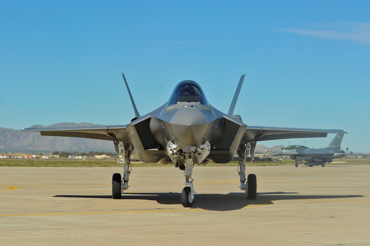 The F-35 Lightning II makes its first appearance March 10, 2014, at Luke Air Force Base. The aircraft was flown in directly from the Lockheed Martin factor at Fort Worth, Tex., and is the first of 144 F-35s that will eventually be assigned to the base. (U.S. Air Force photo/Staff Sgt. Darlene Seltmann) 
