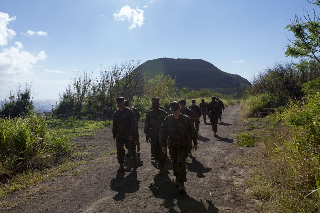 Marines and sailors with Combat Logistics Regiment 37 hike back from Mount Suribachi Jan. 31 during a professional military education trip to Iwo To. Mount Suribachi is the highest point on the island and was the location of Joe Rosenthal’s famous photo of five Marines and a corpsman raising a U.S. flag. CLR-37 is with 3rd Marine Logistics Group, III Marine Expeditionary Force.