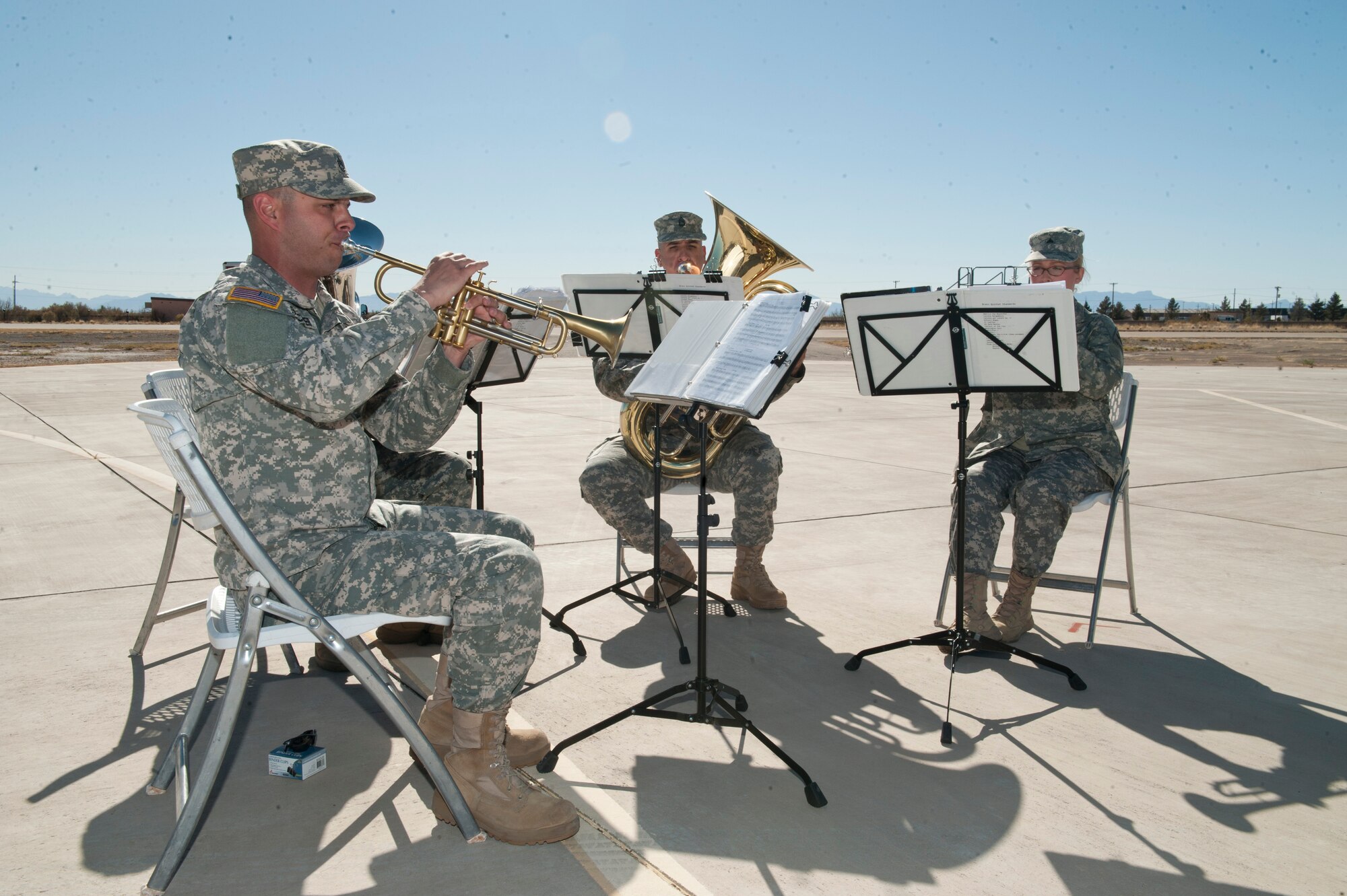 The 1st Armored Division, Band Brass Quintet from Fort Bliss, Texas, performs during the 54th Fighter Group activation ceremony at Holloman Air Force Base, N.M., March 11. The 54th Fighter Group, a tenant unit at Holloman, is a detachment the 56th Fighter Wing at Luke Air Force Base, Ariz., and will ultimately operate two F-16 Fighting Falcon aircraft training squadrons. The 54th Fighter Group plus three squadrons were activated at the ceremony: the 311th Fighter Squadron, the 54th Operations Support Squadron and the 54th Aircraft Maintenance Squadron. (U.S. Air Force photo by Senior Airman Daniel E. Liddicoet/Released)