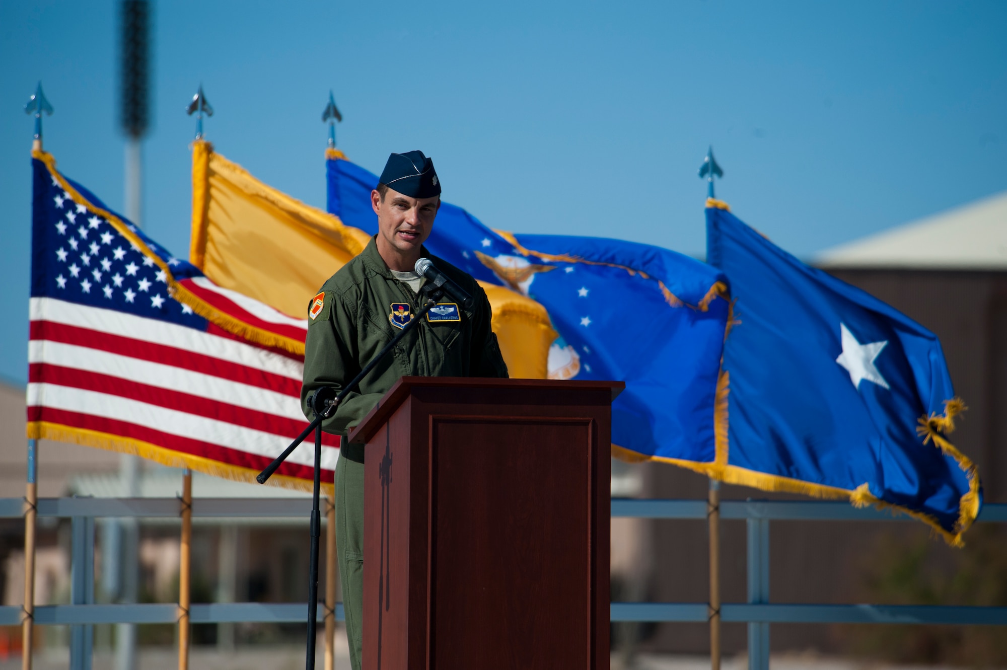 Lieutenant Col. Marshall Chalverus, 54th Operation Support Squadron commander, delivers a speech during the 54th Fighter Group activation at Holloman Air Force Base, N.M., March 11. The 54th Fighter Group, a tenant unit at Holloman, is a detachment the 56th Fighter Wing at Luke Air Force Base, Ariz., and will ultimately operate two F-16 Fighting Falcon aircraft training squadrons. The 54th Fighter Group plus three squadrons were activated at the ceremony: the 311th Fighter Squadron, the 54th Operations Support Squadron and the 54th Aircraft Maintenance Squadron. (U.S. Air Force photo by Airman 1st Class Aaron Montoya / Released)