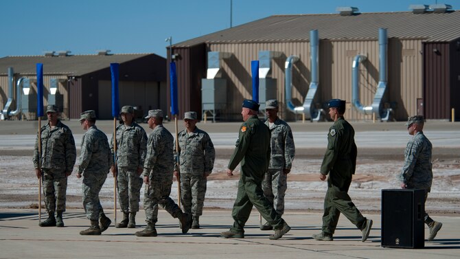 The official party arrives to the 54th Fighter Group activation ceremony at Holloman Air Force Base, N.M., March 11. The 54th Fighter Group, a tenant unit at Holloman, is a detachment the 56th Fighter Wing at Luke Air Force Base, Ariz., and will ultimately operate two F-16 Fighting Falcon aircraft training squadrons. The 54th Fighter Group plus three squadrons were activated at the ceremony: the 311th Fighter Squadron, the 54th Operations Support Squadron and the 54th Aircraft Maintenance Squadron. (U.S. Air Force photo by Airman 1st Class Aaron Montoya / Released)