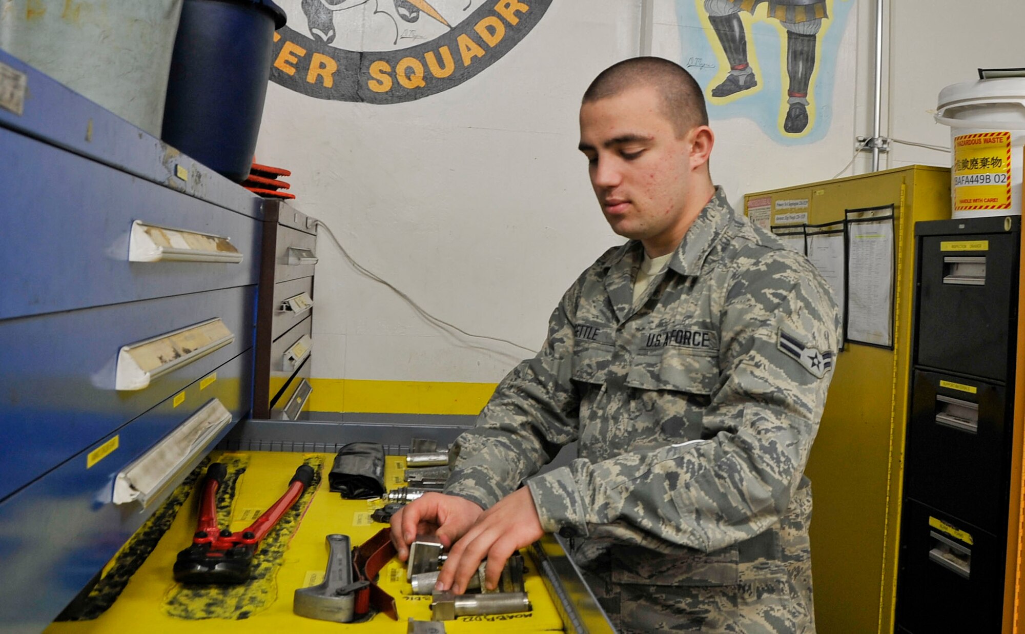 U.S. Air Force Airman 1st Class Brandon L. Gettle, 14th Aircraft Maintenance Unit mission support and supply technician , organizes tools for inventory Mar. 10, 2014, Misawa Air Base, Japan. Gettle makes sure every supply and tool is accounted for to help carry out the mission. (U.S. Air Force photo/Airman 1st Class Patrick S. Ciccarone)