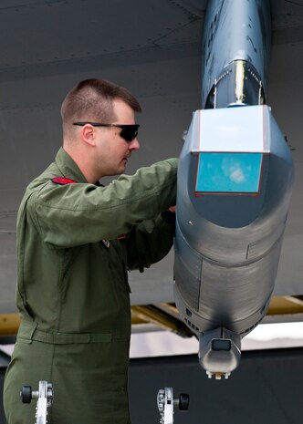 U.S. Air Force Capt. Timothy Humpal, 343rd Bomb Squadron radar navigator, performs pre-flight checks on a B-52 Stratofortress assigned to the 96th Bomb Squadron from Barksdale Air Force Base, La. during Red Flag 14-2 March 6, 2014, Nellis AFB, Nev. Red Flag provides realistic air combat missions in a training environment. The exercise training missions ensure air and ground crews are better prepared for future real-world operations. (U.S. Air Force photo by Airman 1st Class Thomas Spangler)

