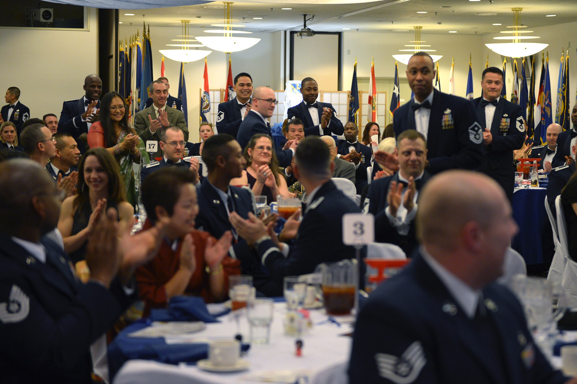Base personnel applaud 2013 annual award nominees at Yokota Air Base, Japan, Feb. 28, 2014. More than 50 individuals were nominated for their contributions to the base. (U.S. Air Force photo by Airman 1st Class David Danford/Released)