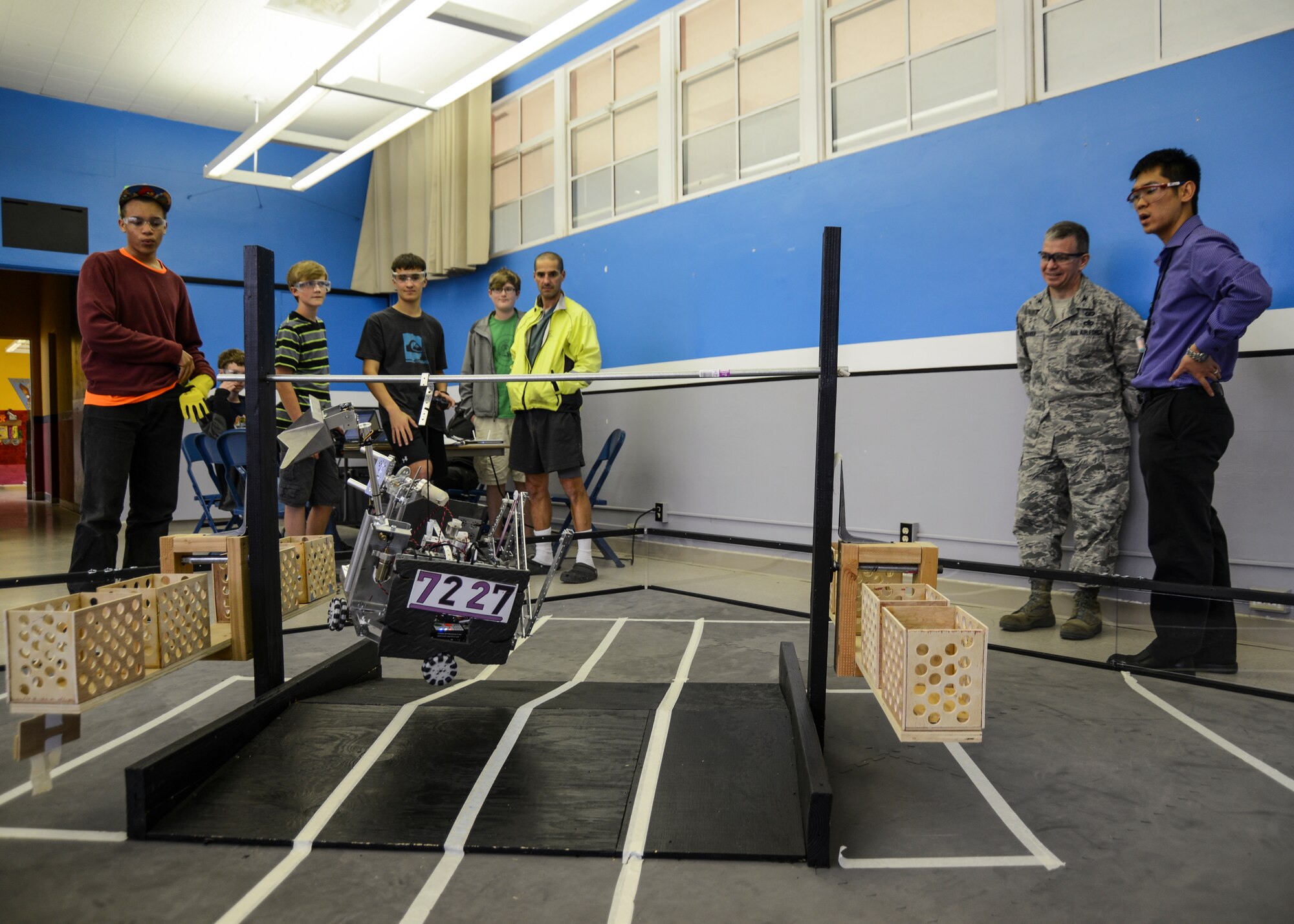 The team practices their “pull-up," which they hope to use at the Western United States Super Regional Championship in Sacramento, Calif., Mar. 20-22. The team will earn extra points during the competition if the robot is able to pull itself up and hang from a bar for a specified duration of time. (U.S. Air Force photo by Rebecca Amber)
