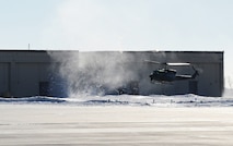 A UH-N1 helicopter lands near the tactical response force building preparing to pick personnel up at Minot Air Force Base, N.D., Feb. 21, 2014. The 54th Helicopter Squadron historically descended from the Aerospace Rescue and Recovery unit whose primary mission was the location and rescue of missing or endangered individuals.  (U.S. Air Force photo/Senior Airman Andrew Crawford)
