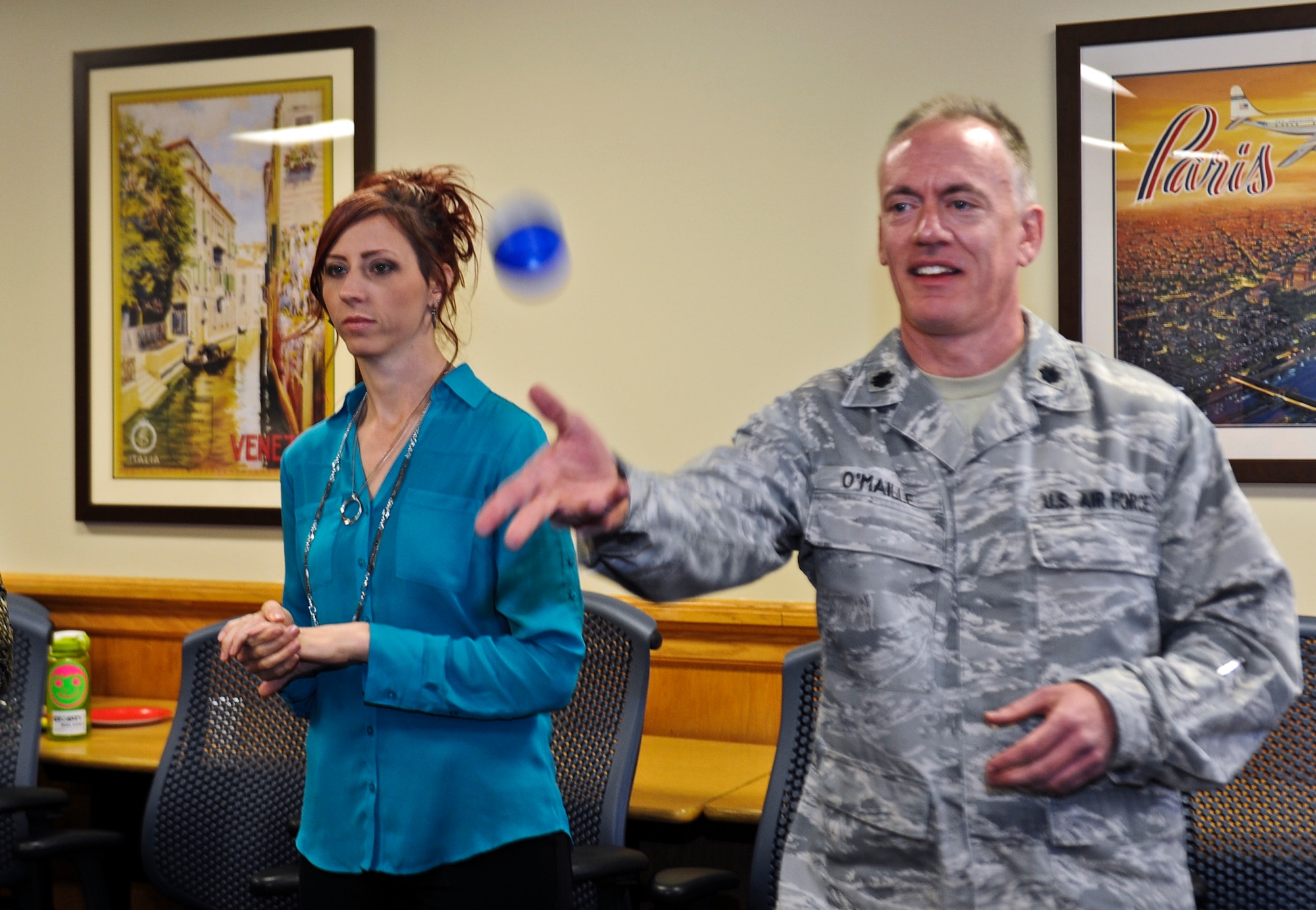 Lt. Col. Patrick O’Maille, 1st Special Operations Support Squadron clinical psychologist, tosses a ball during an exercise at the Airman & Family Readiness Center on Hurlburt Field, Fla., March 11, 2014. The Preservation of the Force and Family providers learned about the 1st Special Operation Wing’s missions during an immersion day. (U.S. Air Force photo/Senior Airman Michelle Patten)