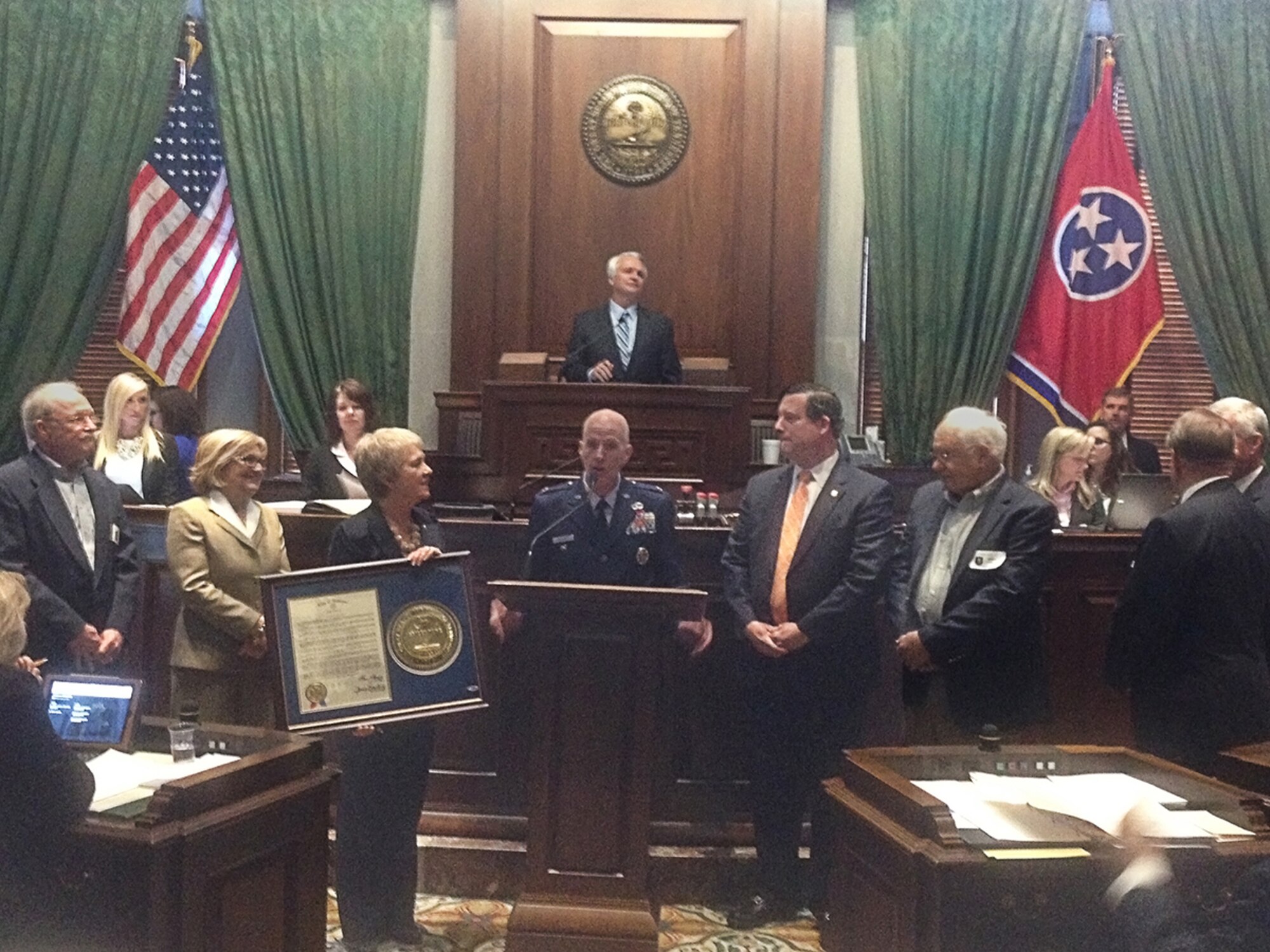 A proclamation was presented to AEDC by the Tennessee Senate and House of Representatives on March 10 proclaiming March 12 as AEDC Day in Tennessee. AEDC Test Support Division Director Col. James Krajewski (center), was present to accept the proclamation along with Arnold Community Council President Ben Craig (right of Krajewski). Also shown standing with Krajewski is (l-r) Industrial Board of Coffee County Executive Director Ted Hackney, Congressman Diane Black, Senator Janice Bowling and Industrial Board of Coffee County Chairman Bill Comer. (Photo by provided)