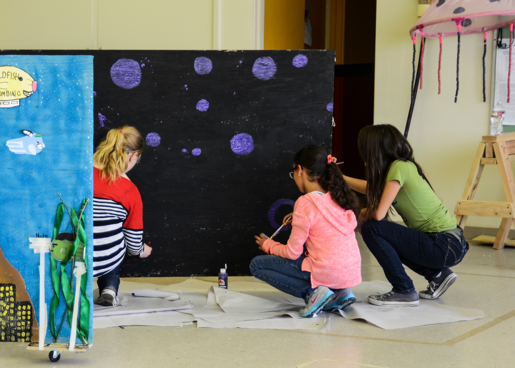 One of the Jr. High-aged teams chose to work on the performance problem, “Seeing is Believing.” At the competition, the team will have to perform a skit incorporating a moving set piece and costumes. (U.S. Air Force photo by Rebecca Amber)
