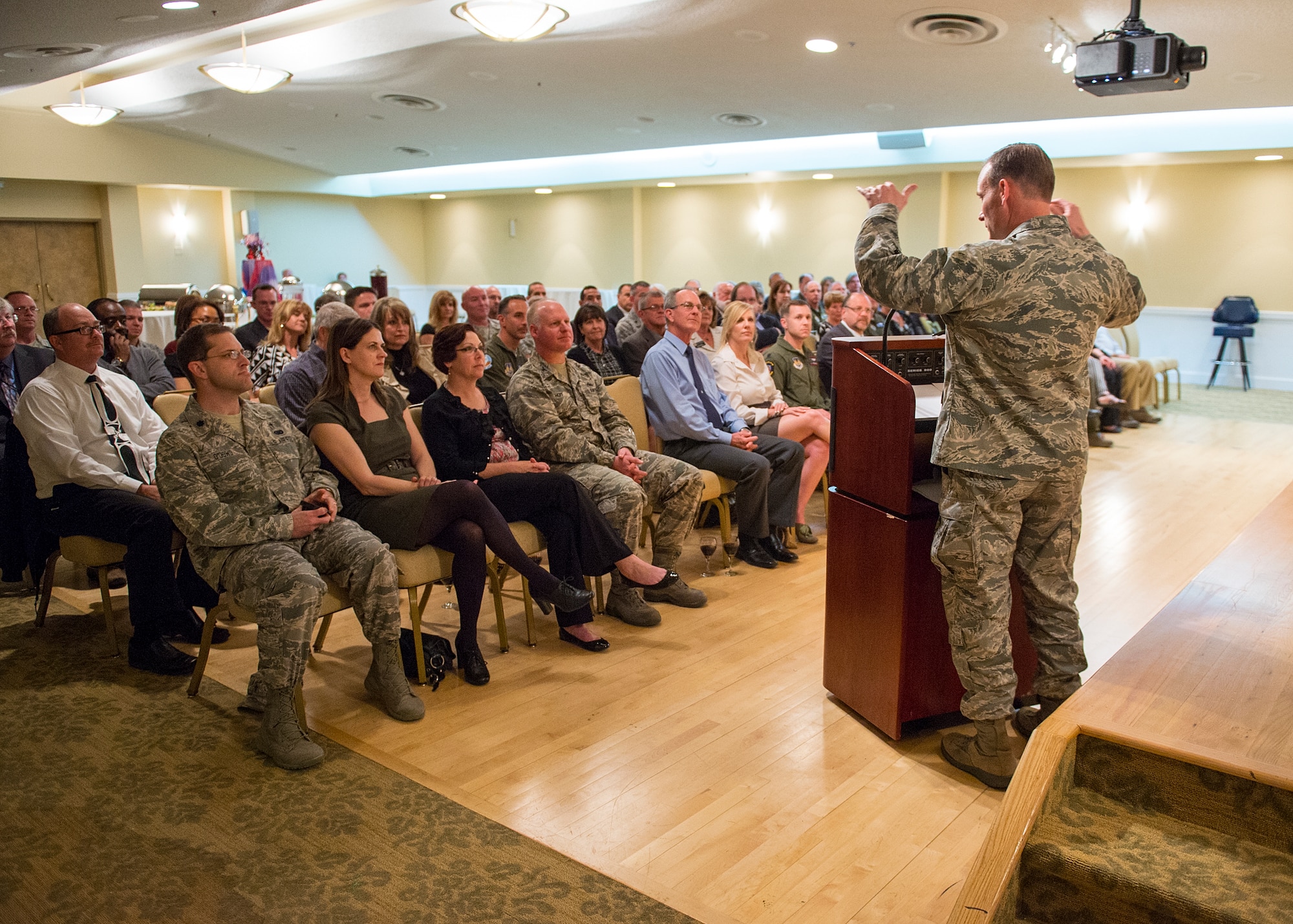 Col. Dan Daetz, 412th Test Wing vice commander, welcomes Edwards AFB's new honorary commanders March 5. The ceremony was held at Club Muroc where the HCCs were introduced to their military counterparts and enjoyed drinks and hors d'oeurves. Honorary commanders are asked to serve a one-year term. (U.S. Air Force photo by Edward Cannon)