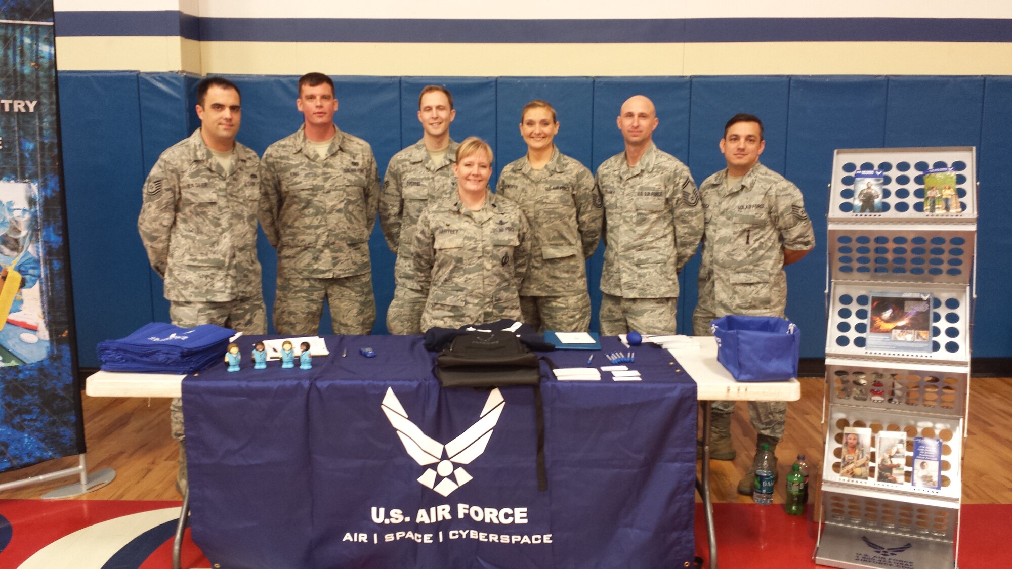 Members of the 317th Recruiting Squadron sponsored and judged a Vex Robotics competition in Roanoke, Va., Feb. 22. From left are Tech. Sgt. Patrick Sadler, Tech. Sgt. Justin King and Senior Airman Eric Overbee, all 317th RCS recruiters; Lt. Col. Charity Hartley, 317th RCS commander; Master Sgt. Wendy Rewerts, 317th RCS G-Flight chief; Senior Master Sgt. Cory Frommer, 317th RCS production superintendent; and Tech. Sgt. Joseph Arduca, 317th RCS recruiter. The competition challenged area high school students to build the most innovative robots possible and were judged for sportsmanship, teamwork and creativity. The Air Force recruiters teamed up with ROTC cadets from Liberty University to mentor the students.  (U.S. Air Force photo)