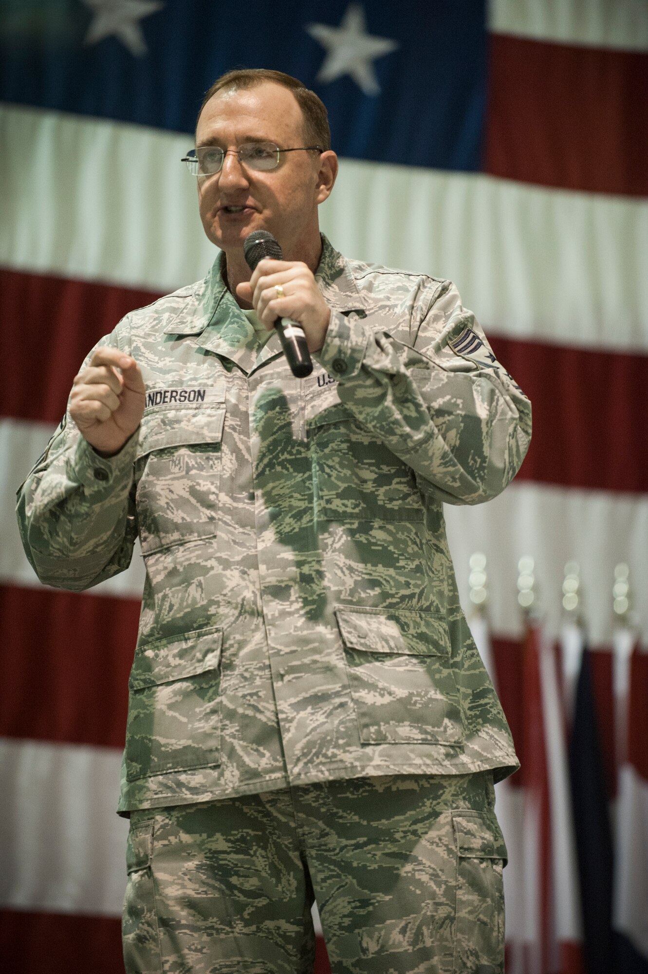 Chief Master Sgt. Marty Anderson speaks to maintainers from the 5th Maintenance Group and the 705th Munitions Squadron during the Maintenance Professional of the Year banquet at Minot Air Force Base, N.D., Feb. 7, 2014. The MPOY banquet recognizes the achievements of the maintenance group and honors maintenance professionals each year.  (U.S. Air Force photo/Airman 1st Class Sahara L. Fales)