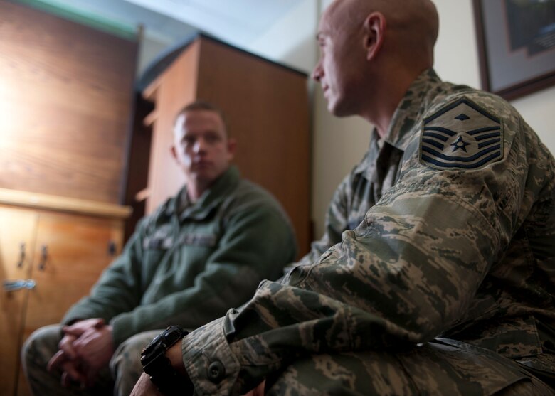 ALTUS AIR FORCE BASE, Okla. – U.S. Air Force Master Sgt. Jason Buckley, 97th Logistics Readiness Squadron first sergeant speaks, with an Airman, Feb. 10, 2014. First sergeants act as a link between commanders, enlisted personnel and support agencies. They advise on career progression, personnel programs, financial matters and family needs. (U.S. Air Force photo by Senior Airman Jesse Lopez/Released)