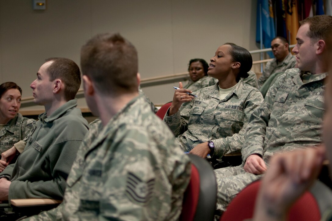 JOINT BASE ELMENDORF-RICHARDSON, Alaska -- Staff Sgt. Tia Boglin addresses a leadership principle concern during a mass peer discussion at the Enlisted Leadership Seminar 2014 here March 1, 2014. Seventy-five junior non-commissioned officers from the Alaska Air National Guard's 176 Wing gathered for a leadership conference organized by the Kulis Chief's Council. National Guard photo by Staff Sgt. N. Alicia Halla/ Released.