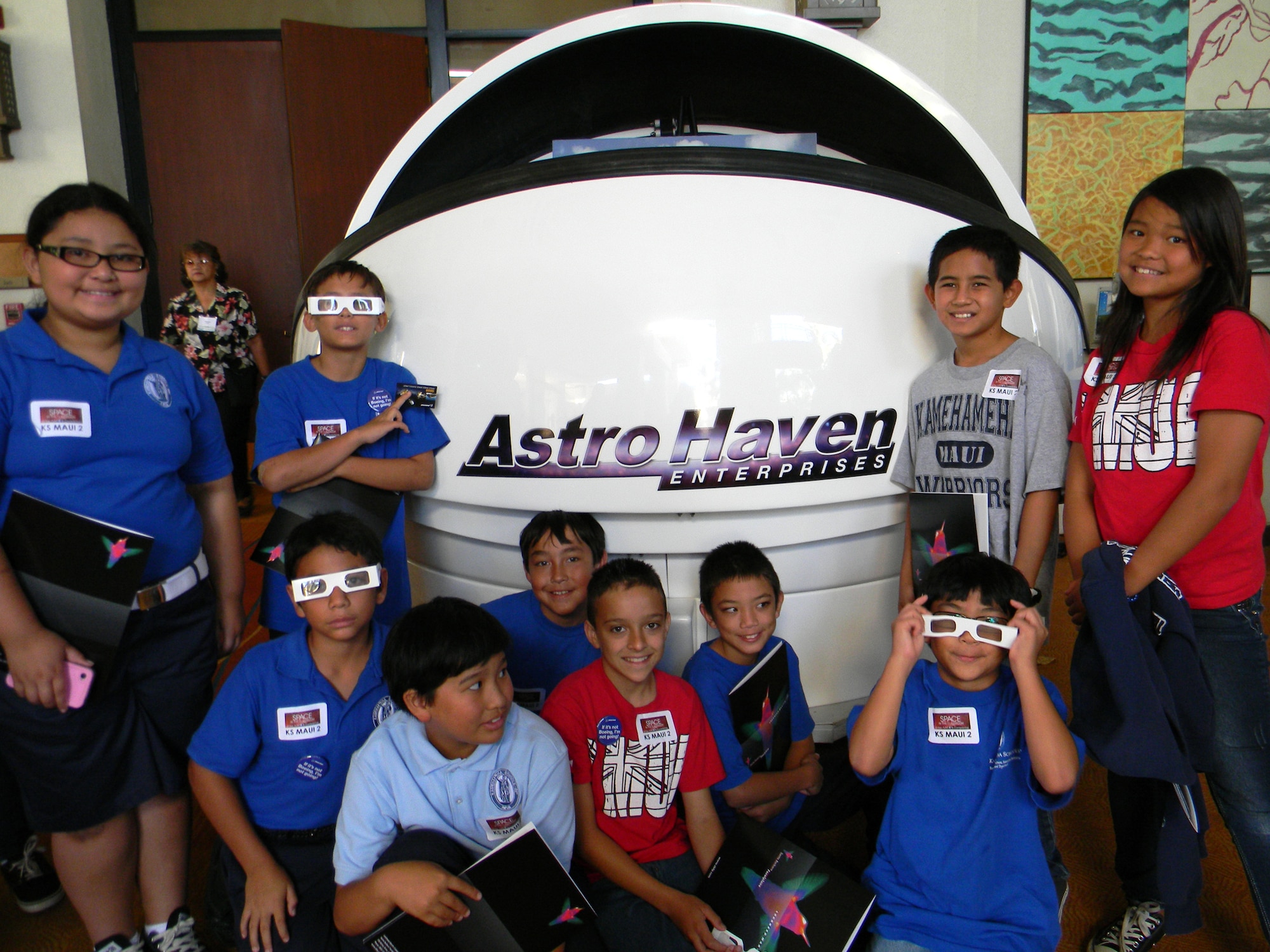 Maui students in front of the remote telescope dome cover donated by AstroHaven. The remote telescope will be used live in classrooms across the United States and Hawaii. (Photo courtesy Maui Economic Development Board)