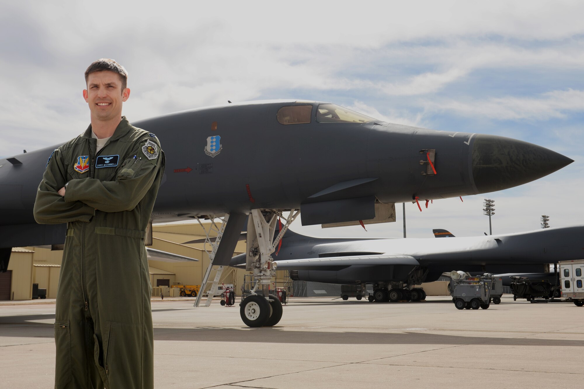 Capt. Christopher McConnell, 28th Operations Support Squadron wing weapons officer, poses in front of a B-1 bomber at Ellsworth Air Force Base, S.D. March 12, 2014. McConnell was awarded the prestigious Robbie Risner Award for his contributions to the Air Force mission in 2013. (U.S. Air Force photo by Airman 1st Class Rebecca Imwalle/Released)