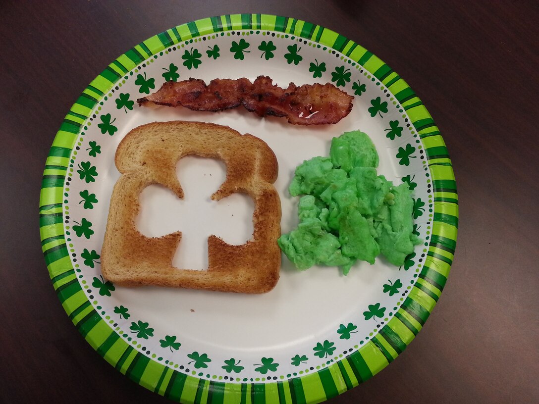 A Green Eggs and "Ham" breakfast with a side of shamrock shaped toast were served during the Hearts Apart event for deployed families March 8, 2014, in honor of Dr. Seuss Week. Families were able to connect with one another, as well as reach out to their distant loved ones through United through Reading. (courtesy photo/ Tech Sgt. Amanda Mocanu)