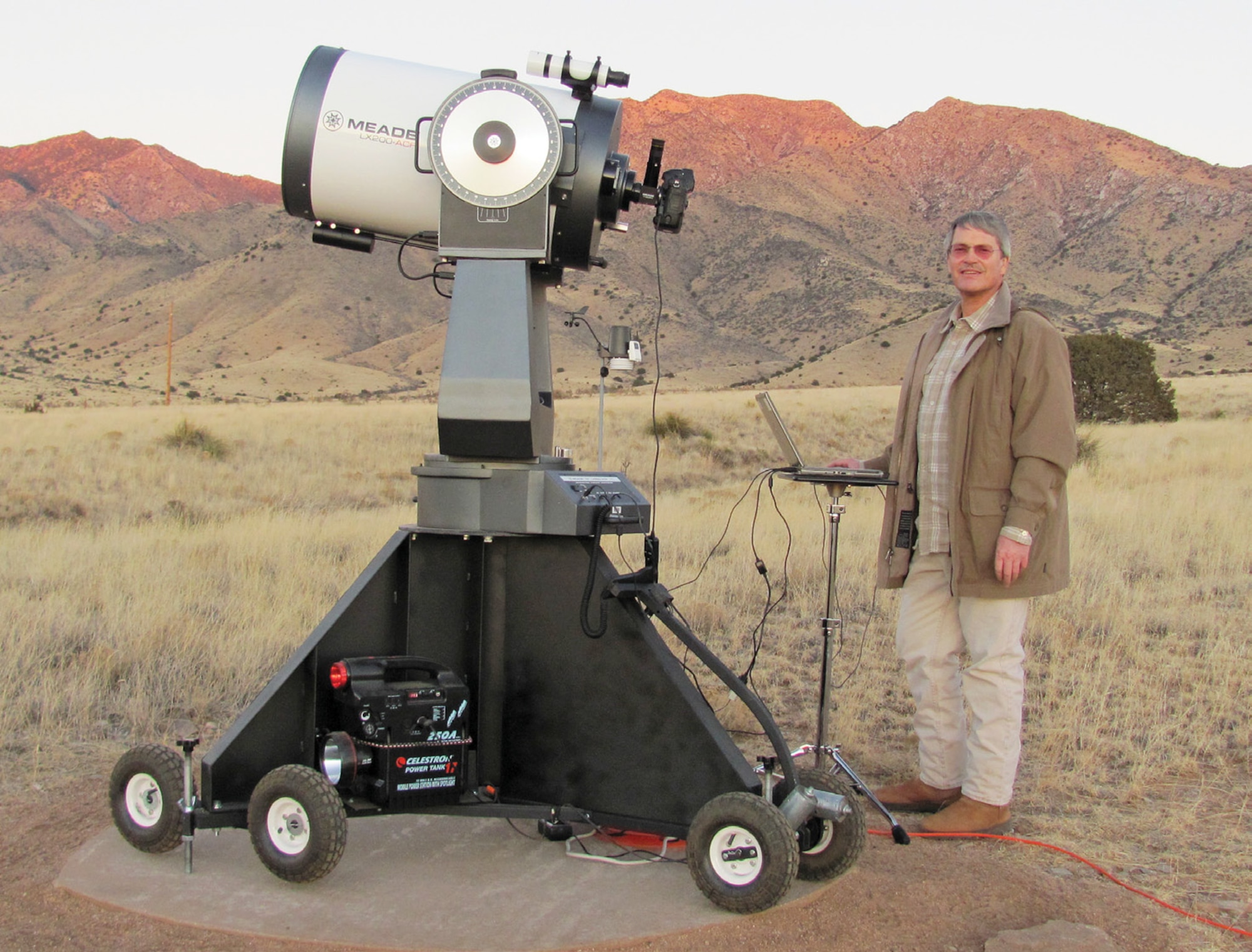 Richard Rast, senior engineer with the Air Force Research Laboratory’s Satellite Assessment Center, stands by a 16-inch diameter telescope.  Small telescopes are less expensive and more portable than large telescopes. Small telescopes are less expensive and more portable than large telescopes.