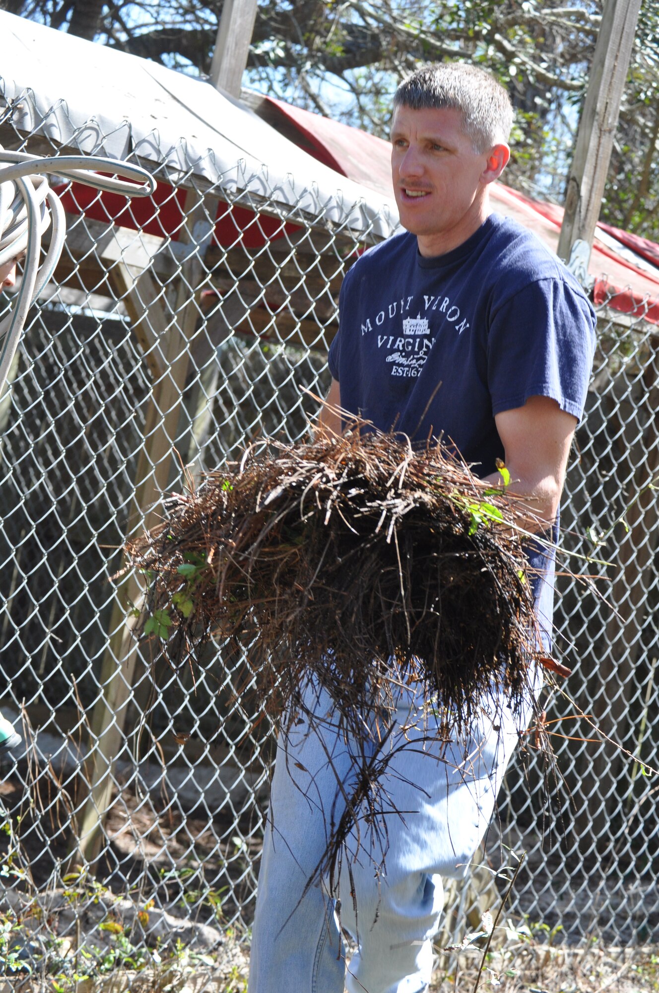 An Airman helps with landscaping at the new Humane Society of Bay County adoption facility. Team Tyndall Airmen partnered with more than 40 non-profit organizations as part of their quarterly Comprehensive Airmen Fitness Day March 10. The day was focused on giving back to Bay County with volunteer service projects. (Air Force Photo by Ashley M. Wright)  