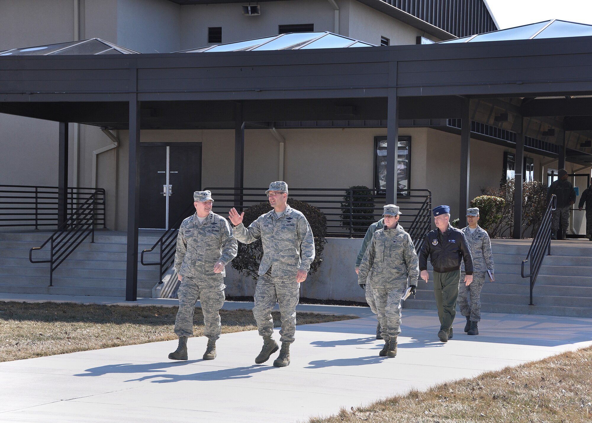 Col. Raymond A. Kozak, 512th Airlift Wing commander, escorts Lt. Gen. James F. Jackson, Air Force Reserve Command commander, during a tour of the 512th Airlift Wing, Dover Air Force Base, Del., March 1, 2014. Jackson addressed reservists during an all-call that day, and Chief Master Sgt. Cameron B. Kirksey, AFRC command chief, met with Airmen, NCOs and senior NCOs during three enlisted calls the following day. (U.S. Air Force photo/Senior Airman Erika Brooke)