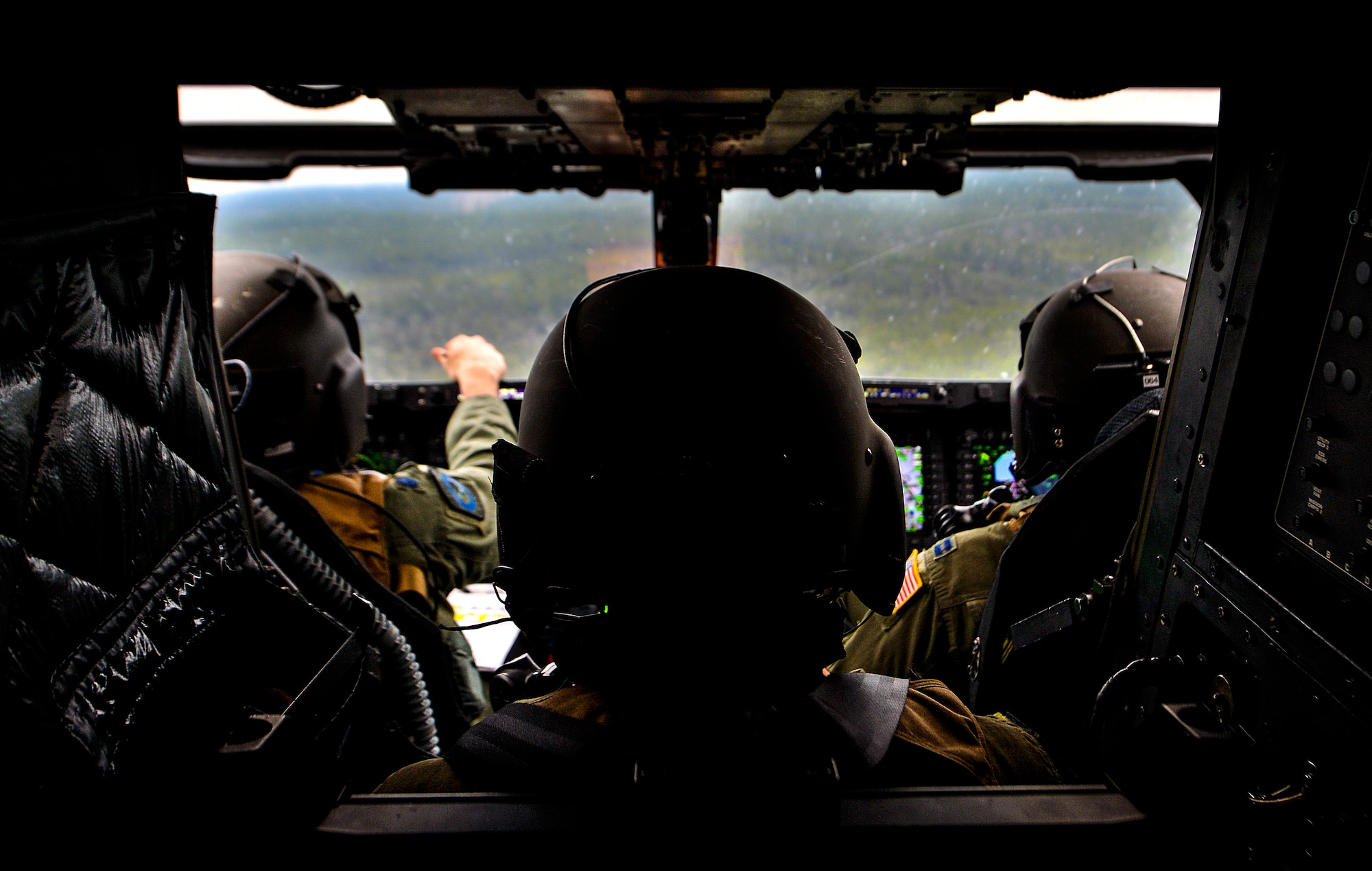 Tech. Sgt. Edilberto Malave, 8th Special Operations Squadron flight engineer, looks out the front windows of a CV-22 Osprey near Hurlburt Field, Fla., March 6, 2014. Malave was involved in an Osprey crash in June 2012, but has been recertified and cleared to perform the mission. (U.S. Air Force photo/Senior Airman Christopher Callaway) 