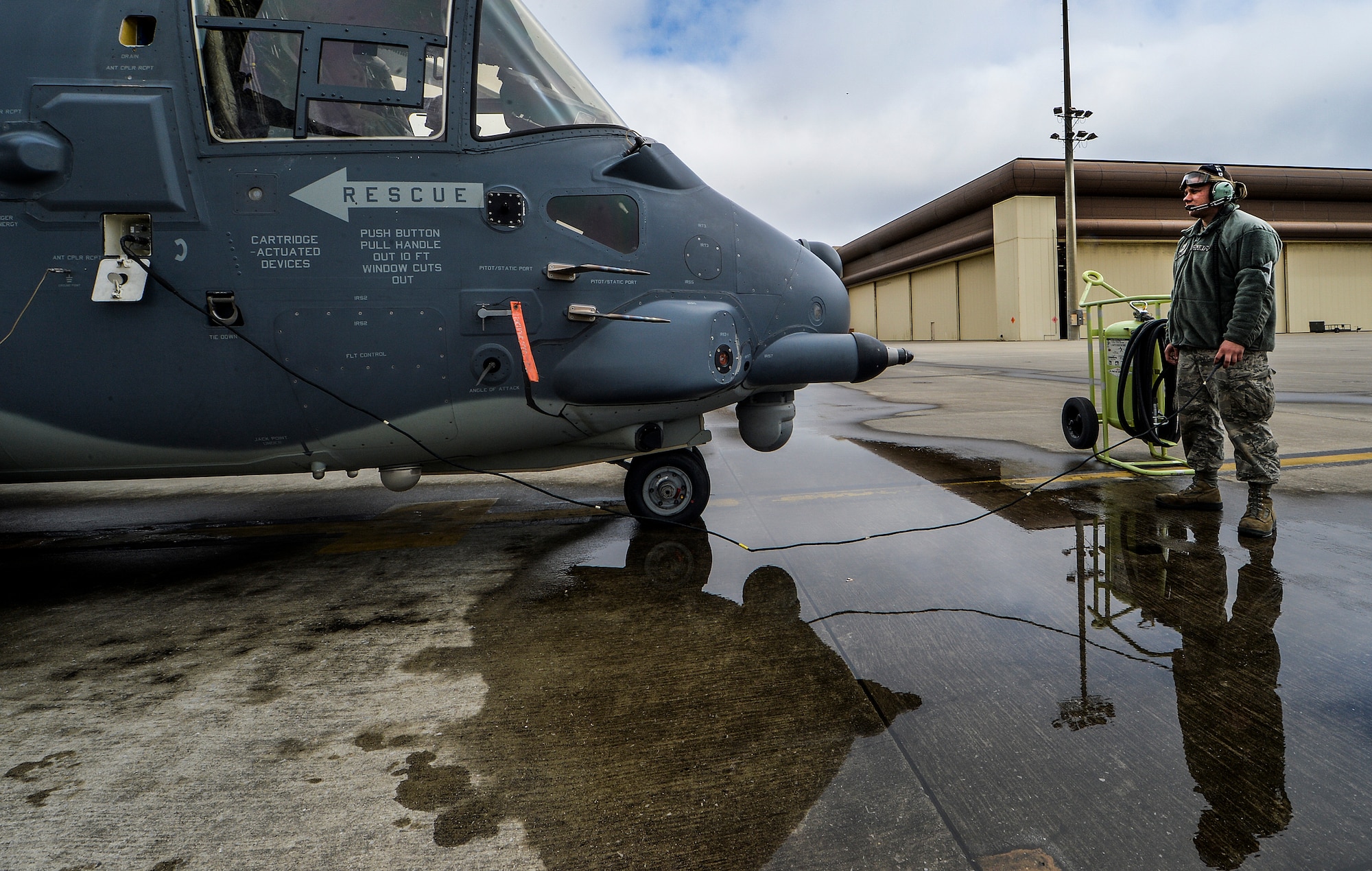 Airman 1st Class Kyle Koepkey, 8th Special Operations Squadron CV-22 propulsion apprentice, looks over a CV-22 Osprey during pre-flight inspections on Hurlburt Field, Fla., March 6, 2014. The Osprey is a multi-mission, military, tilt-rotor aircraft with vertical takeoff and landing capability. (U.S. Air Force photo/Senior Airman Christopher Callaway) 