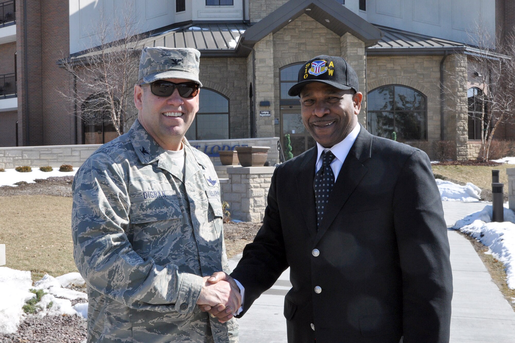 YOUNGSTOWN AIR RESERVE STATION, Ohio – Air Force Reserve Col. James Dignan (right), commander of the 910th Airlift Wing and Mayor Doug Franklin, of the nearby City of Warren, stand in front of the Eagle’s Nest Lodge during the mayor’s installation visit here, March 7, 2014. Mayor Franklin visited YARS to learn more about the wing’s mission and the installation’s features firsthand as well as meet some of the Citizen Airmen assigned here.