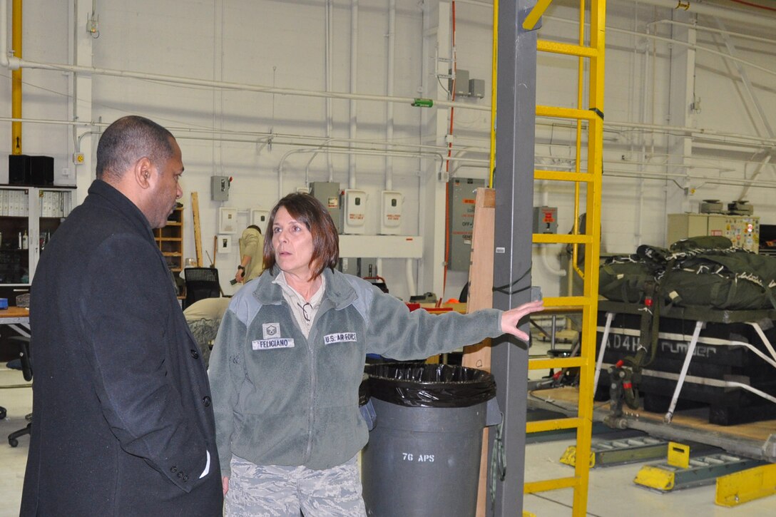 YOUNGSTOWN AIR RESERVE STATION, Ohio – After a walkthrough of the YARS lodging facilities, the mayor’s tour continued on to the 910th Airlift Wing’s 76th Aerial Port Squadron. Air Force Reserve Master Sgt. Christine Feliciano (right), an aerial delivery maintainer assigned to 76th APS, talks with Mayor Doug Franklin (left), of the nearby City of Warren, in the APS hangar here about the unit’s role in preparing parachute-delivered cargo pallets for the 910th Airlift Wing’s mission to “Deliver, Deploy, Defend,” March 7, 2014. The mayor visited YARS to learn more about the wing’s capabilities and the installation’s features firsthand as well as meet some of the Citizen Airmen assigned here.