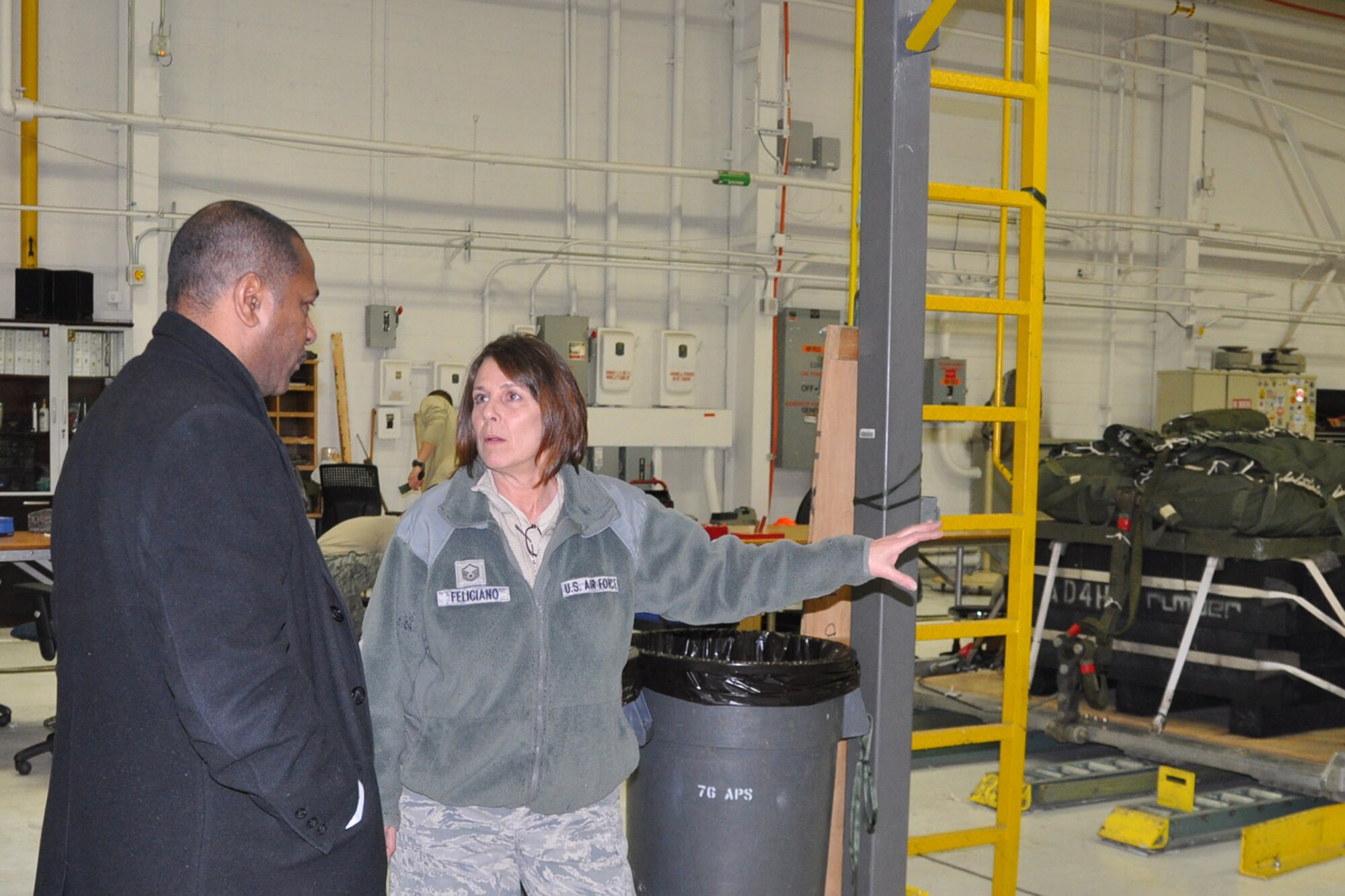 YOUNGSTOWN AIR RESERVE STATION, Ohio – After a walkthrough of the YARS lodging facilities, the mayor’s tour continued on to the 910th Airlift Wing’s 76th Aerial Port Squadron. Air Force Reserve Master Sgt. Christine Feliciano (right), an aerial delivery maintainer assigned to 76th APS, talks with Mayor Doug Franklin (left), of the nearby City of Warren, in the APS hangar here about the unit’s role in preparing parachute-delivered cargo pallets for the 910th Airlift Wing’s mission to “Deliver, Deploy, Defend,” March 7, 2014. The mayor visited YARS to learn more about the wing’s capabilities and the installation’s features firsthand as well as meet some of the Citizen Airmen assigned here.