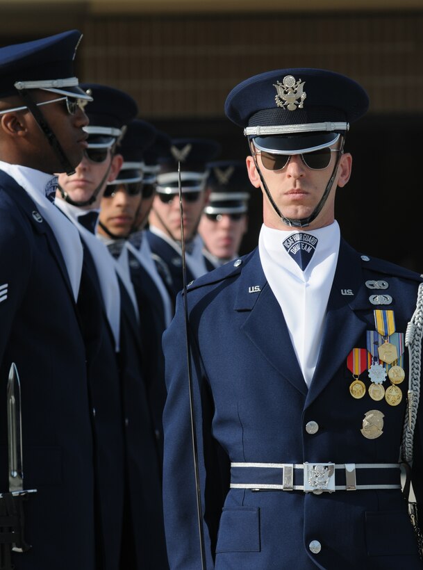 First Lt. Alan Morford, U.S. Air Force Honor Guard Drill Team flight commander, performs a new routine on the drill pad behind the Levitow Training Support Facility March 7, 2014, at Keesler Air Force Base, Miss.  The routine was developed here at Keesler during the past month and will be used for the next year. (U.S. Air Force photo by Kemberly Groue)