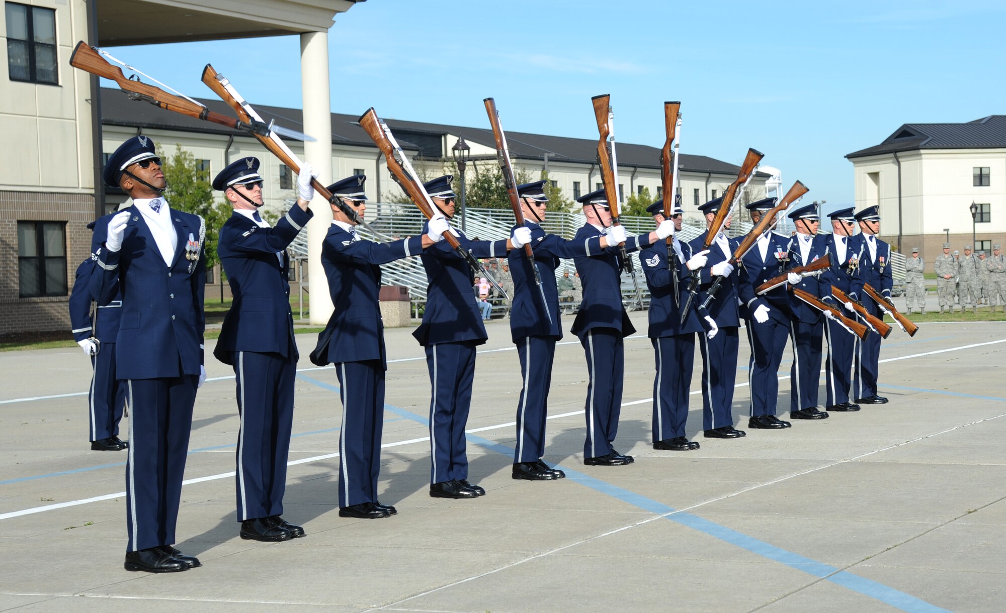 The U.S. Air Force Honor Guard Drill Team performs a new routine on the drill pad behind the Levitow Training Support Facility March 7, 2014, at Keesler Air Force Base, Miss.  The routine was developed here during the past month and will be used for the next year. (U.S. Air Force photo by Kemberly Groue)