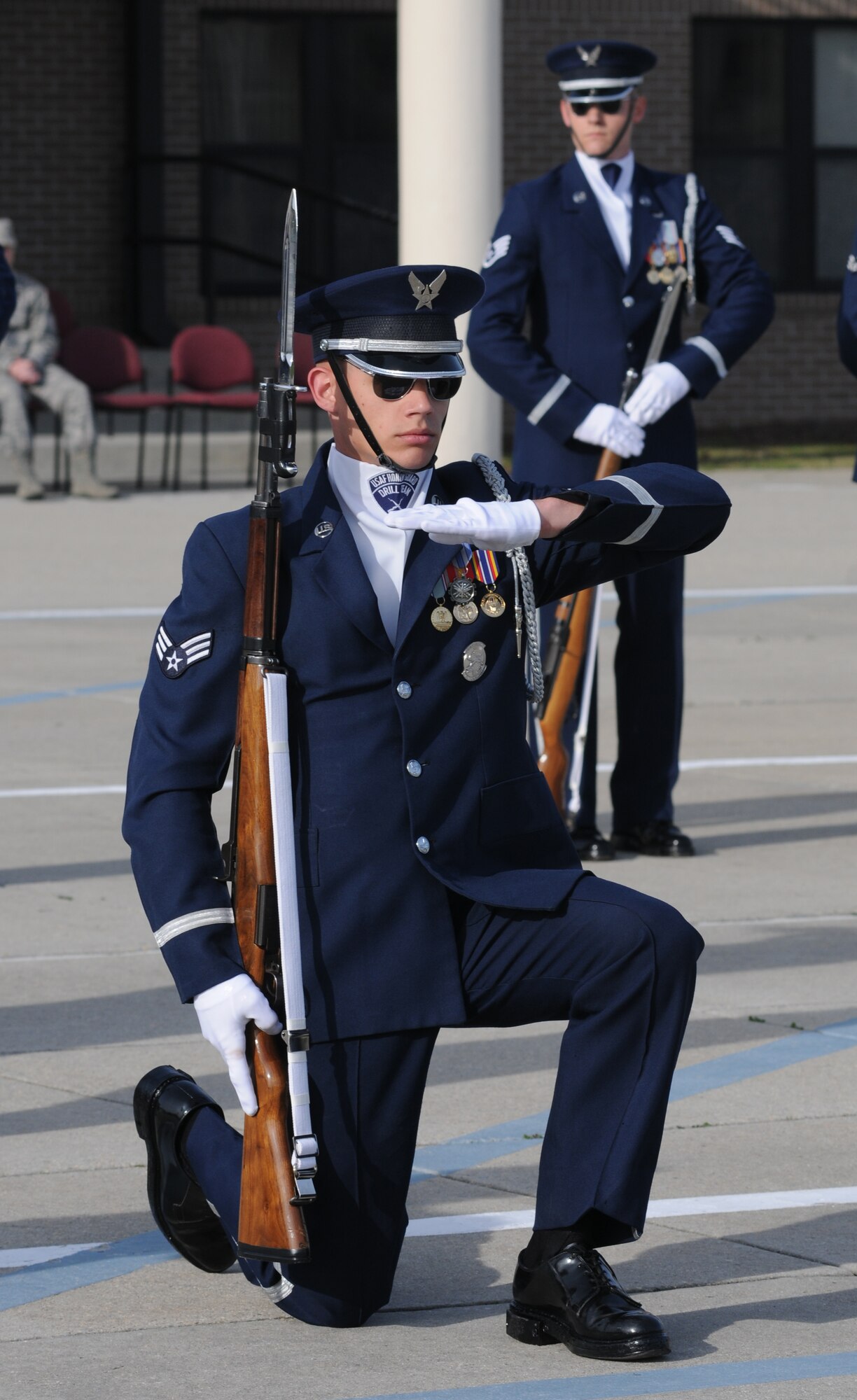 The U.S. Air Force Honor Guard Drill Team performs a new routine on the drill pad behind the Levitow Training Support Facility March 7, 2014, at Keesler Air Force Base, Miss.  The routine was developed here during the past month and will be used for the next year. (U.S. Air Force photo by Kemberly Groue)