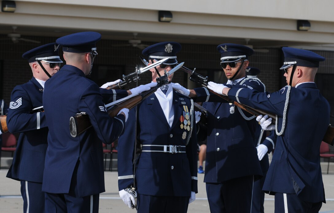 The U.S. Air Force Honor Guard Drill Team performs a new routine on the drill pad behind the Levitow Training Support Facility March 7, 2014, at Keesler Air Force Base, Miss.  The routine was developed here during the past month and will be used for the next year. (U.S. Air Force photo by Kemberly Groue)