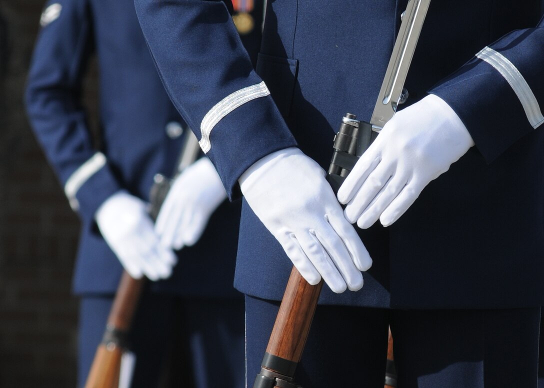The U.S. Air Force Honor Guard Drill Team performs a new routine on the drill pad behind the Levitow Training Support Facility March 7, 2014, at Keesler Air Force Base, Miss.  The routine was developed here during the past month and will be used for the next year. (U.S. Air Force photo by Kemberly Groue)