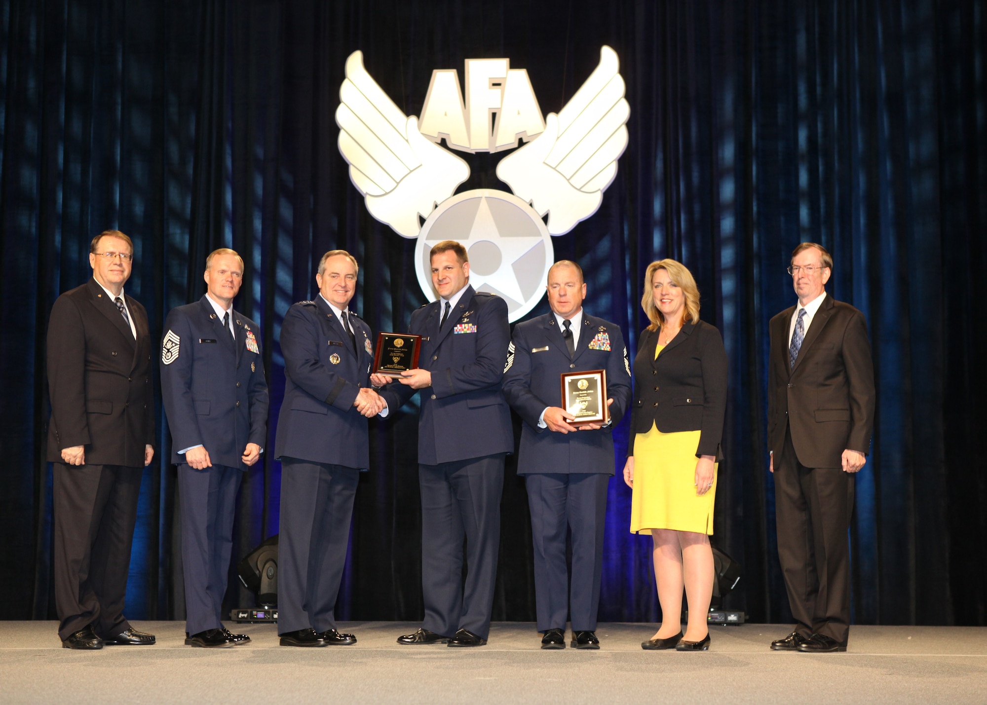 Accepting the Jimmy Doolittle Educational Fellow for Power Projection is Maj. Michael Belardo, B-2 Weapons Officer, 131st Bomb Wing, Missouri Air National Guard.  Air Force Chief of Staff Gen. Mark A. Welsh III presented the award at the AF Gala, Feb 20, 2014, in Orlando, Fl. Welsh and Belardo were joined by (R to L) AFA Central Florida Chapter President Bill Palmby, Secretary of the Air Force Deborah Lee James, Chief Master Sergeant Gary Brown, Chief Master Sergeant of the Air Force James Cody and Air Force Gala Chairman Tim Brock.(Courtesy photo)