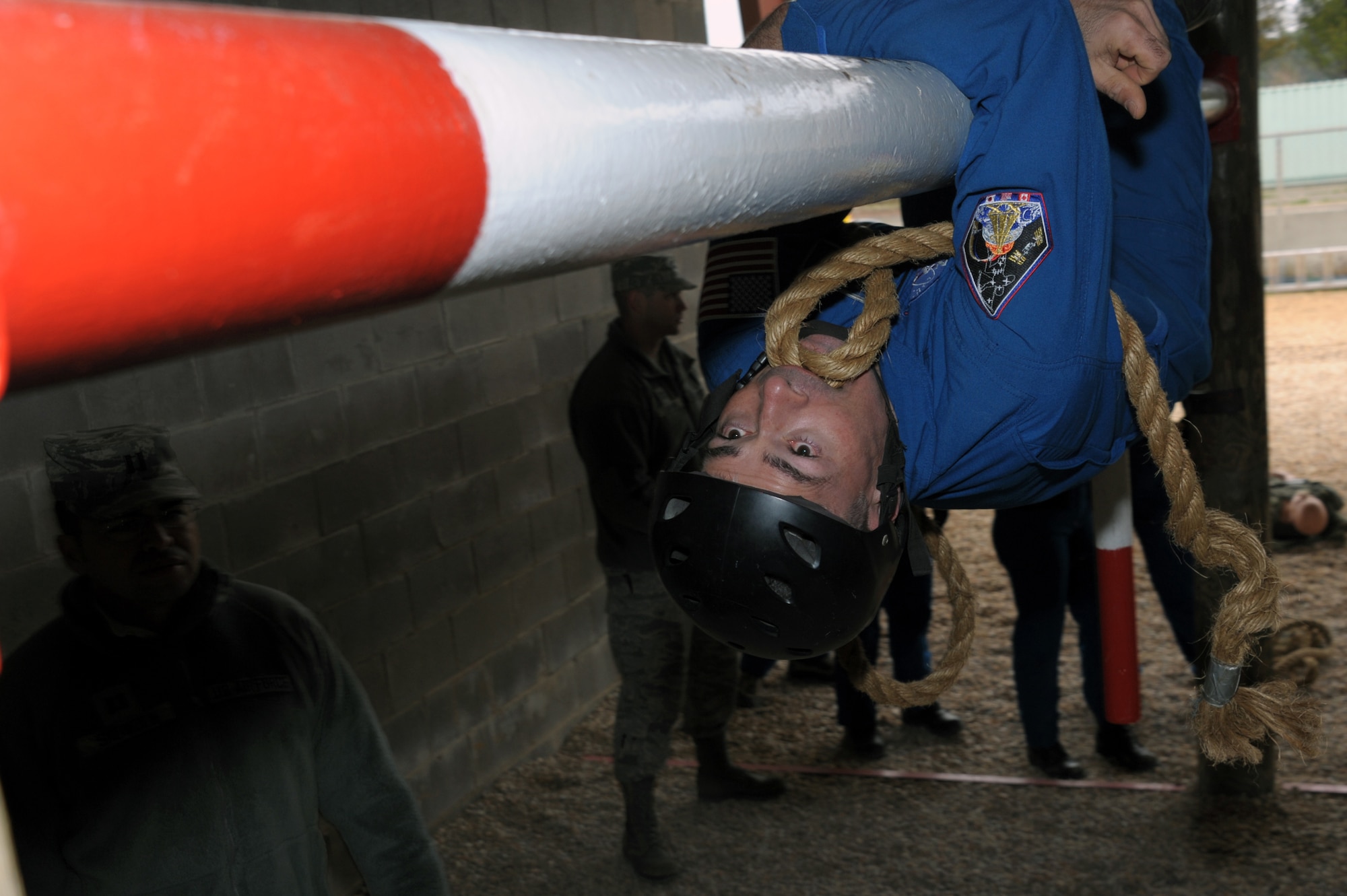 Mark Vande-hei, an astronaut from the NASA Johnson Space Center in Houston, shimmies across a pole as part of a training event at the Squadron Officer College Project X leadership reaction course on Maxwell Air Force Base, March 4th.  Vande-hei is a member of a group of six American and international astronauts who participated in the LRC to hone their communication and teamwork skills. In addition to training in many NASA and international training facilities, Maxwell provides the astronaut with different scenarios and different ways of meeting core leadership training requirements. (U.S. Air Force Photo by Staff Sgt. Gregory Brook)