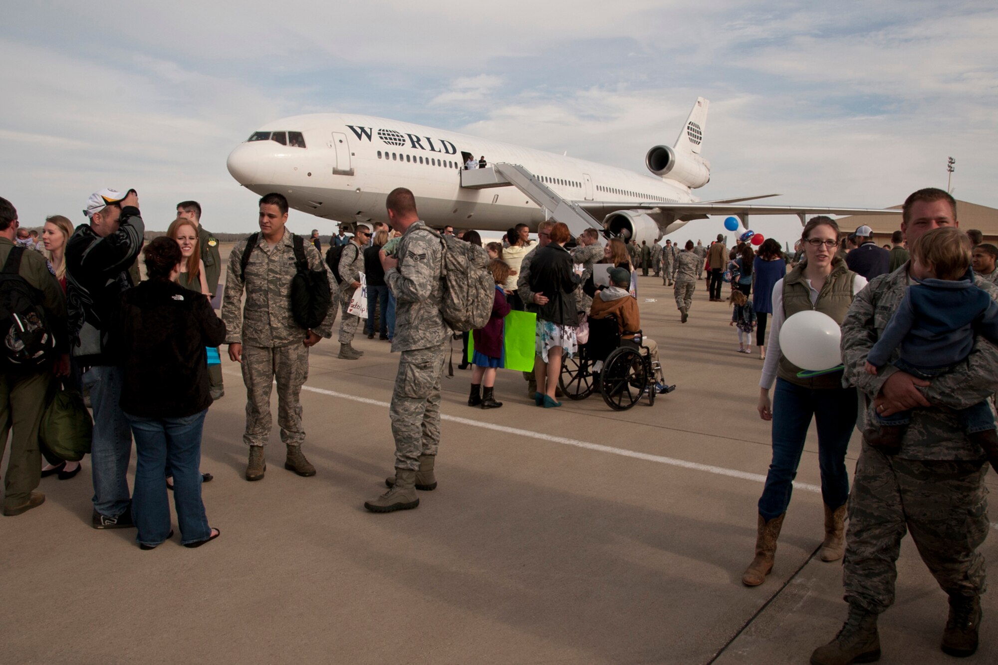 Family, friends and co-workers welcome home group of Airmen from the 2nd and 307th Bomb Wings at Barksdale Air Force Base, La., March 7, 2014. Approximately 280 Airmen from Barksdale deployed to Andersen Air Force Base, Guam, for six months in support of the Air Force's Continuous Bomber Presence in the South China Sea. (U.S. Air Force photo by Master Sgt. Jeff Walston/Released)  