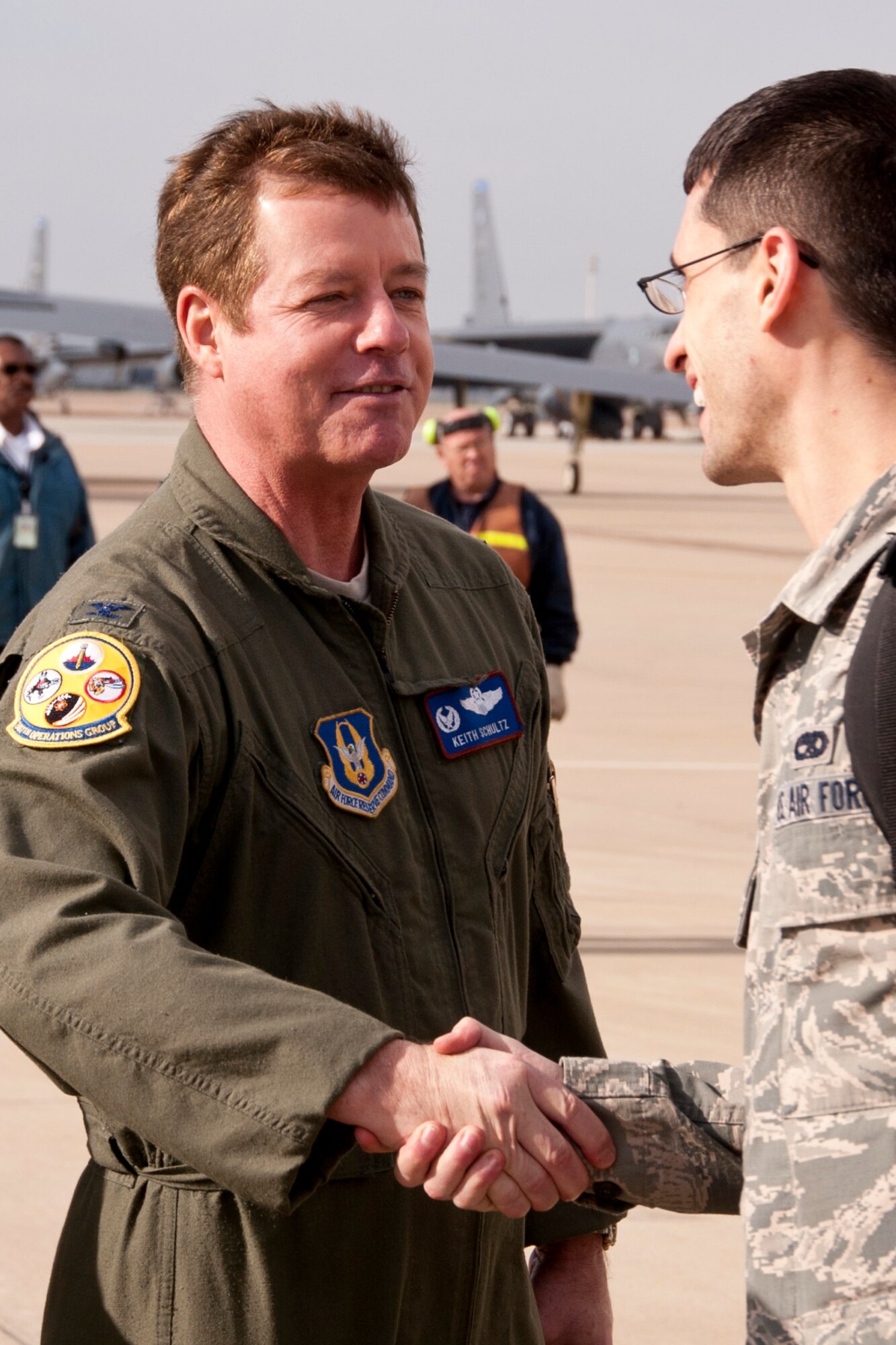 U.S. Air Force Col. Keith Schultz, commander of the 307th Operations Group, greets more than 280 Airmen returning from a six-month deployment to Guam, at Barksdale Air Force Base, La., March 7, 2014. Approximately 18 Airmen from the 307th Bomb Wing were among the group that was deployed to Andersen Air Force Base in support of the Air Force's Continuous Bomber Presence in the South China Sea. (U.S. Air Force photo by Master Sgt. Jeff Walston)  