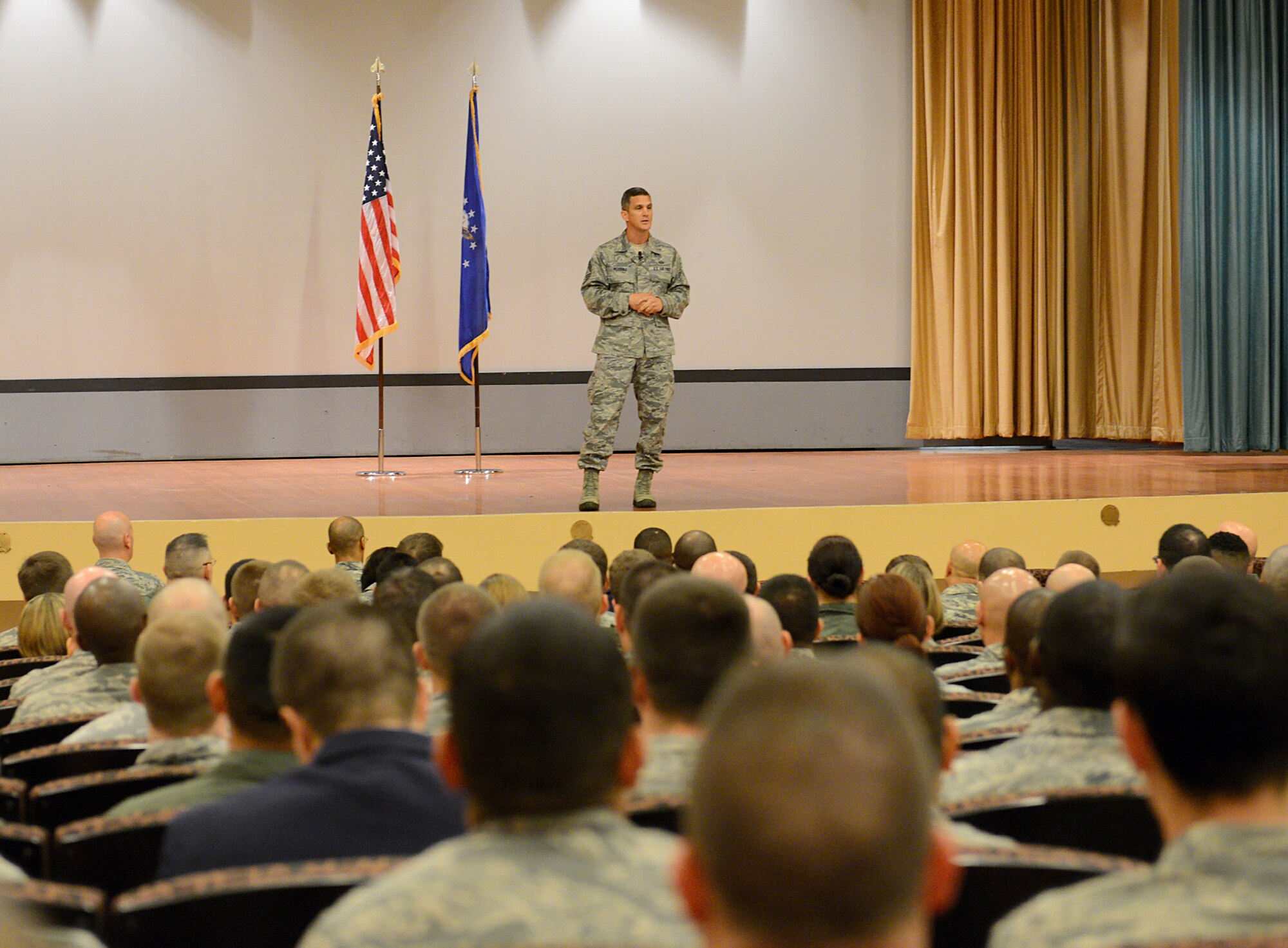 Chief Master Sgt. Richard Parsons, ACC command chief, speaks to a capacity audience at the base theater on Beale Air Force Base, Calif., March 3, 2014. Parsons discussed a number of issues including force management and fiscal challenges. (U.S. Air Force photo by John Schwab/Released)