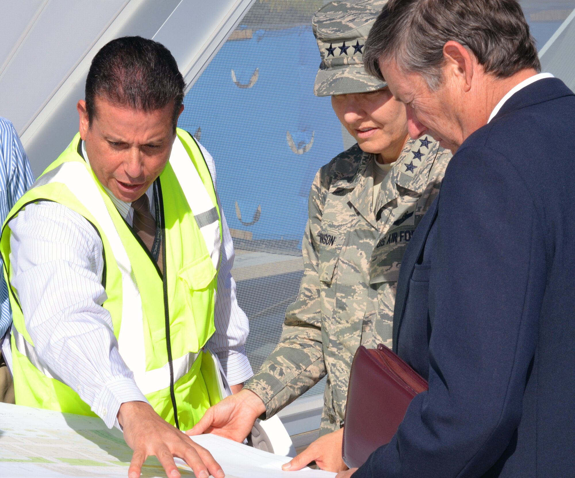 Carlos Cruz-Gonzalez (left), the Academy's director for installations, briefs Lt. Gen. Michelle D. Johnson, the Academy superintendent, and Thomas Berry (right), the Center for Character and Leadership Development's deputy director, on the status of the CCLD's construction here in September. The facility's ongoing construction is funded by a combination of private donors and appropriated funds. (Air Force photo) 