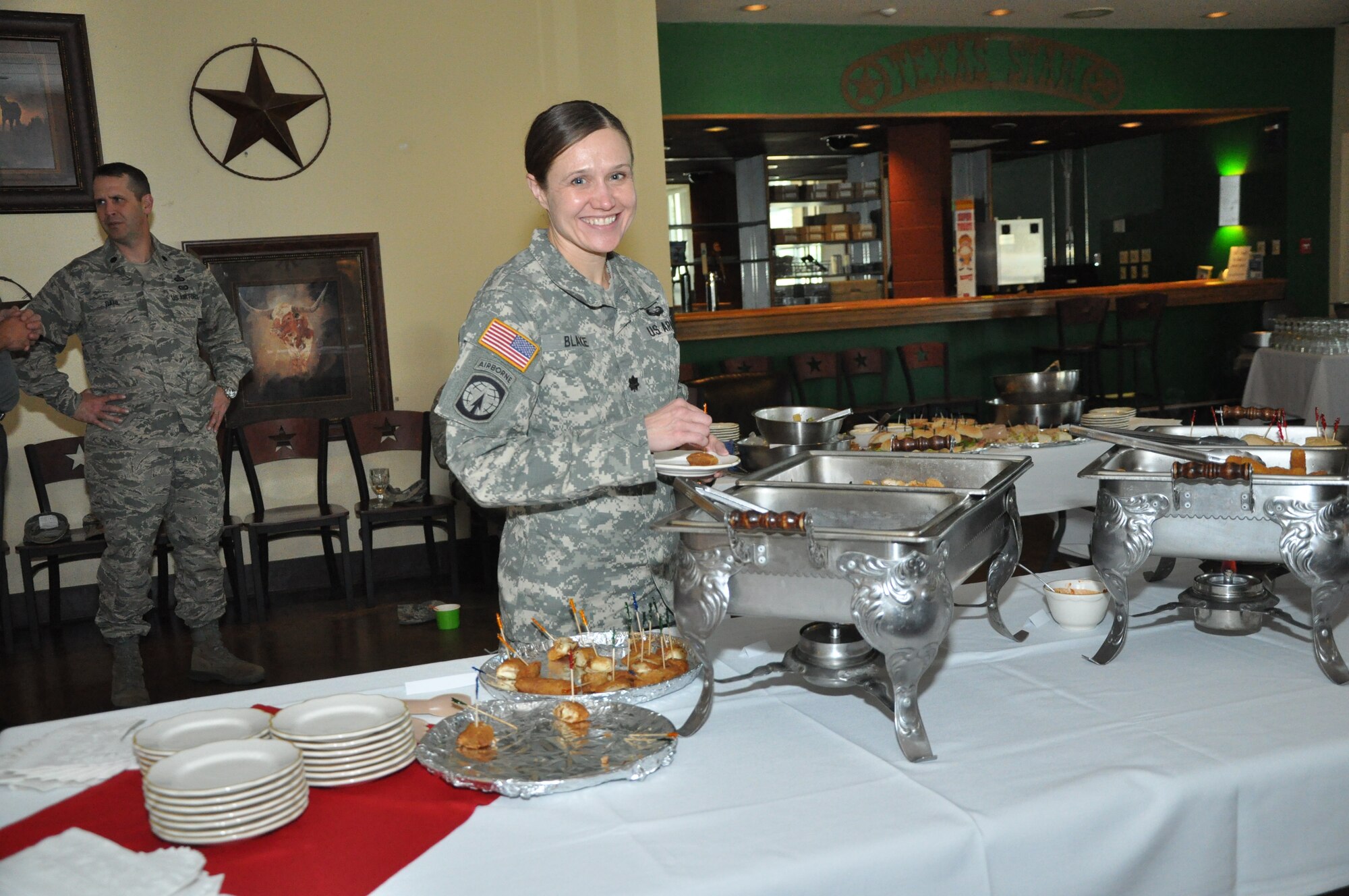 GOODFELLOW AIR FORCE BASE, Texas – Army Lt. Col. Devon Blake, 344th Military Intelligence Battalion Commander, smiles for a picture while trying new entrees and sides during the Gryphon’s Deli March 5. Commanders all over base were invited to taste test these new entrees. (U.S. Air Force photo/ Airman 1st Class Breonna Veal)