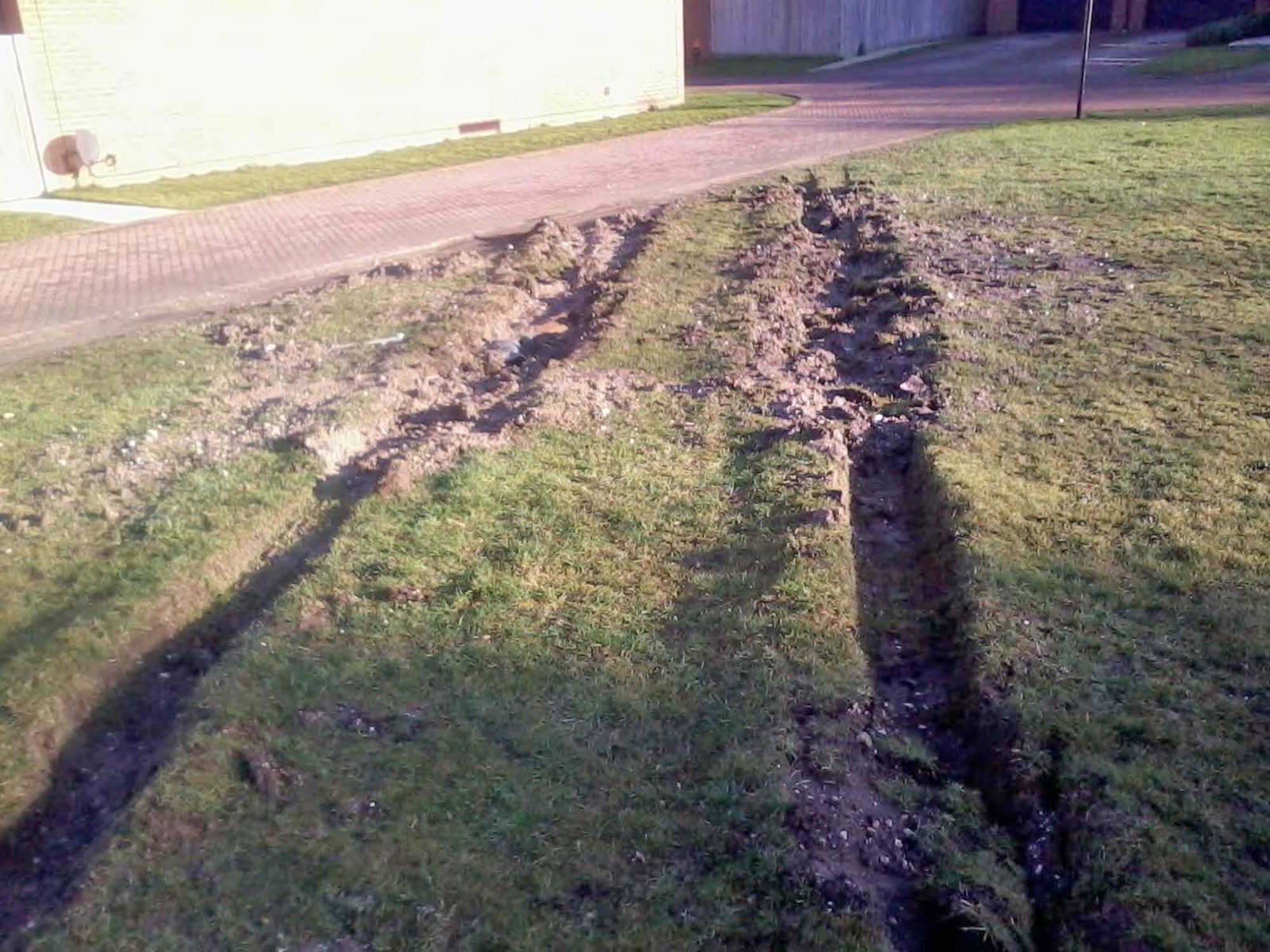Vehicles cause destruction to grass in Liberty Village at Royal Air Force Lakenheath, England. Parking and destruction violations cause damage that can cost the responsible party thousands of dollars. (Courtesy photo/Released) 