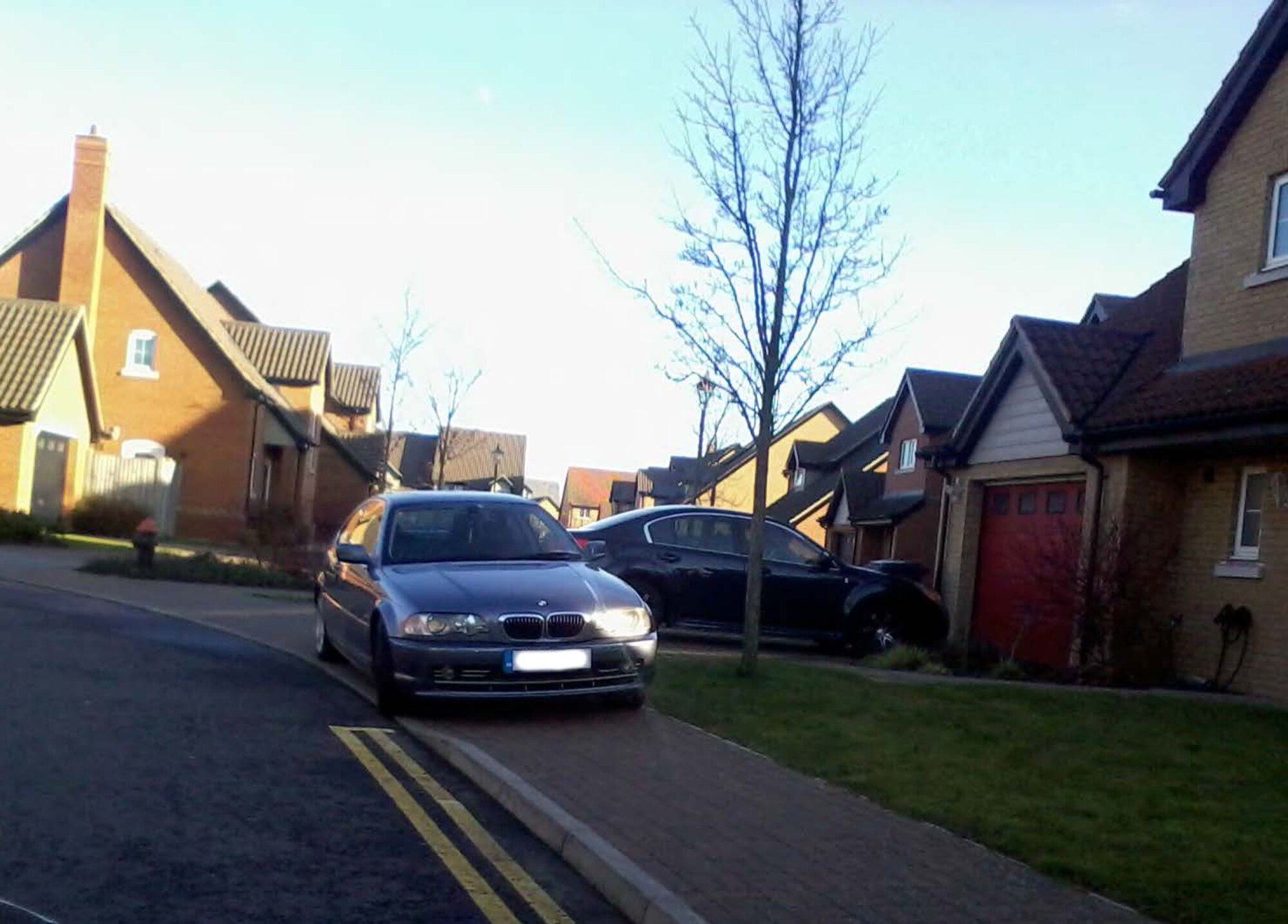 A vehicle is illegally parked on the sidewalk in Liberty Village at Royal Air Force Lakenheath, England.  Parking in non-designated spaces assigned by the housing office, is a violation of 48th Security Forces Squadron and housing office regulations and can result in a suspension of driving privileges. (Courtesy photo/Released)