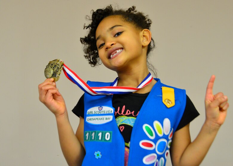 Kennedy Cordle, daughter of Staff Sgt. Brandon Cordle, 436th Civil Engineer Squadron power production craftsman, poses with her youth league basketball participation medal March 1, 2014, at the Youth Center on Dover Air Force Base, Del. All participants in the youth basketball league were presented with participation medals at the end of the season. (U.S. Air Force photo/Airman 1st Class William Johnson)