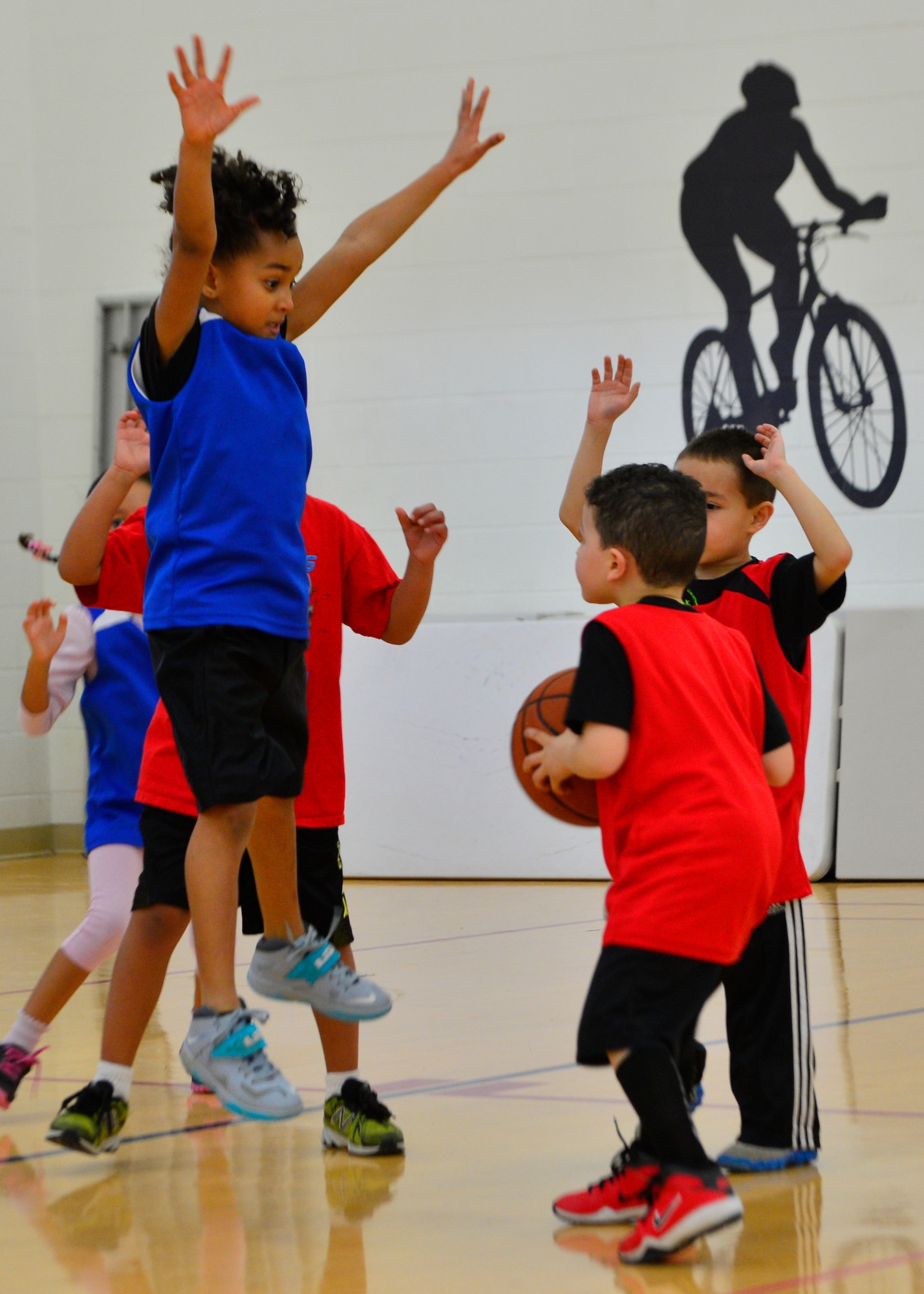 Kennedy Cordle, daughter of Staff Sgt. Brandon Cordle, 436th Civil Engineer Squadron power production craftsman, goes up for a block during a youth league basketball game March 1, 2014, at the Youth Center on Dover Air Force Base, Del. Basketball is one of the many activities Kennedy participates in. (U.S. Air Force photo/Airman 1st Class William Johnson)